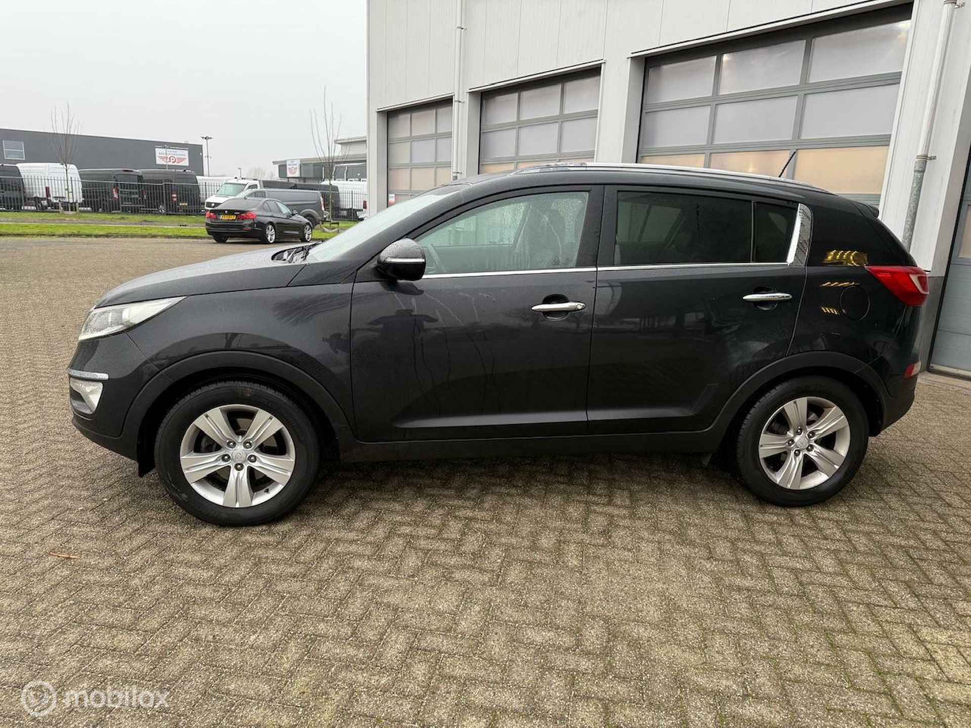 KIA SPORTAGE 2.0 163 PK AUTOMAAT XECUTIVE PLUS PACK 12 MND BOVAG RIJKLAAR PRIJS - 2/13