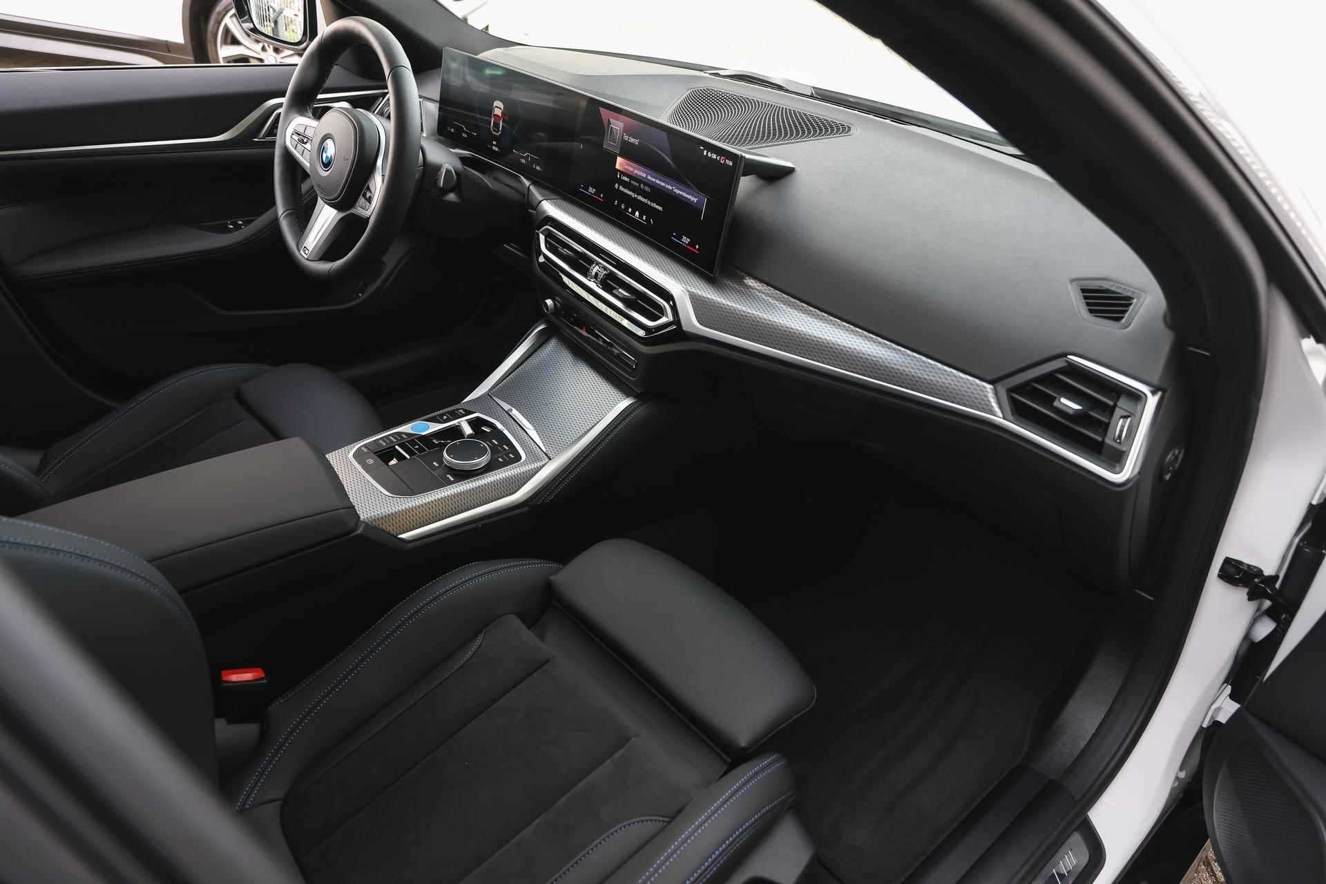 BMW i4 eDrive35 High Executive M Sport 70 kWh / Schuif-kanteldak / Trekhaak / Active Cruise Control / Parking Assistant / Widescreen Display / Live Cockpit Plus - 11/32