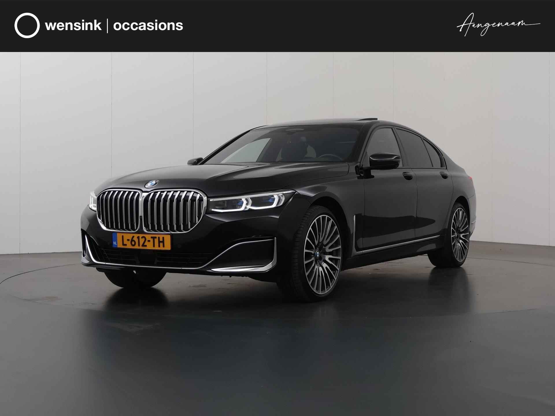 BMW 7-serie 750i xDrive High Executive | SoftClose | Harman/Kardon | Panoramadak | Adaptief onderstel | Lederen zetels + Geheugen | Laser Licht | HUD | 360 Camera | Geluid isolerend glas | Navigatie | Adaptieve CruiseControl | Stoel verwarming + Koeling | Stuurverwarming | - 1/53