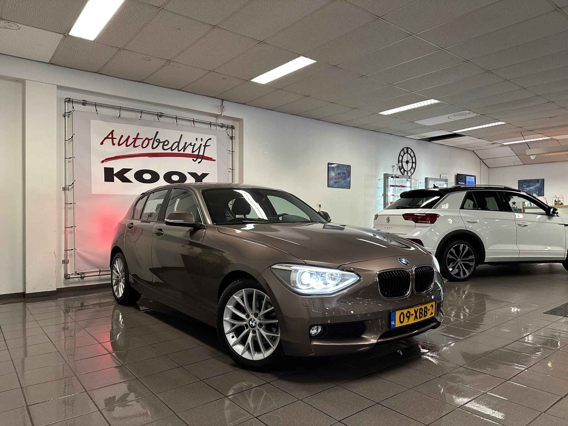 BMW 1-serie 116i Business+ * Automaat / 1e Eig / Navigatie / Xenon / Leder / NL Auto * - 7/23