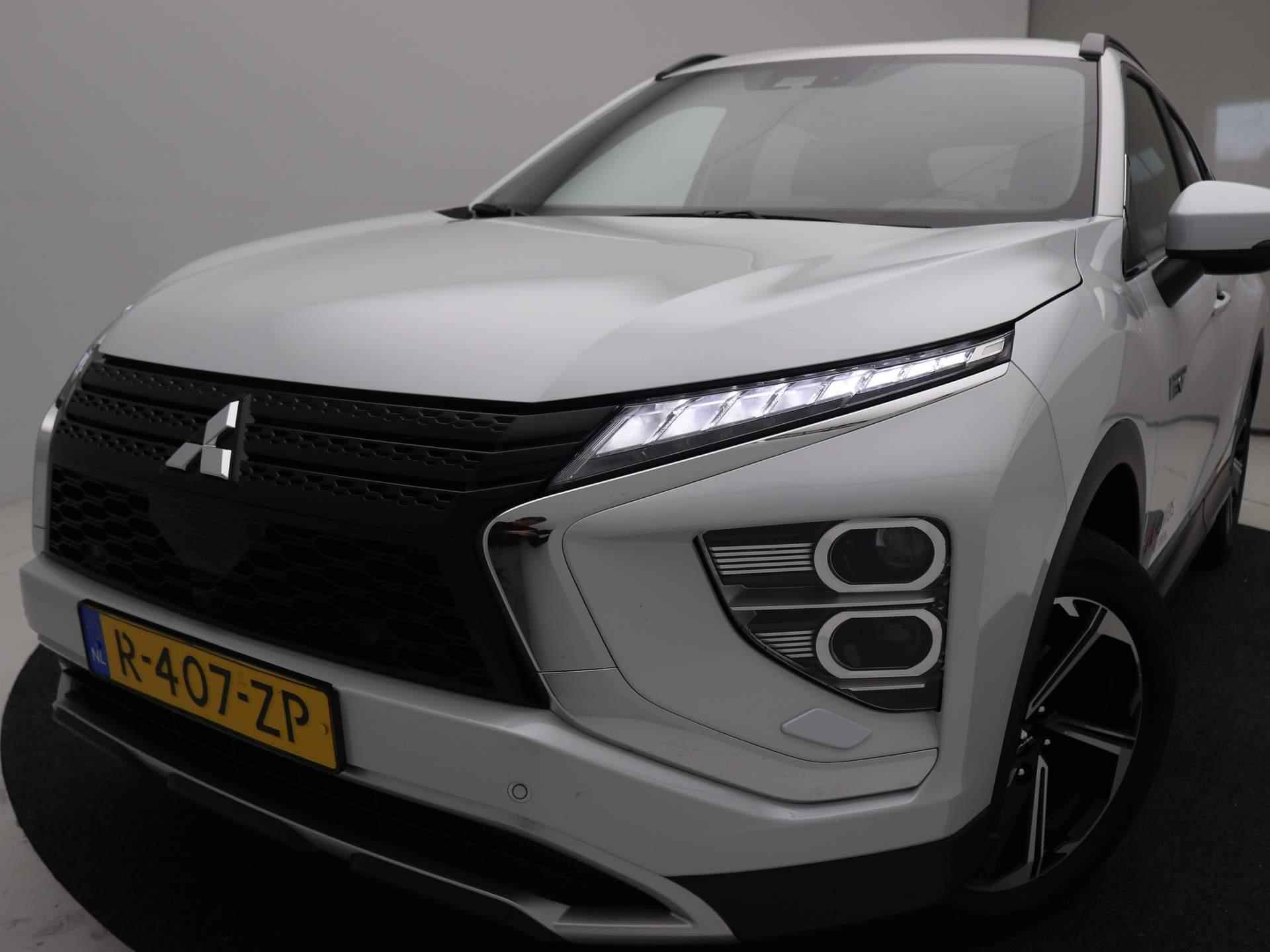 Mitsubishi Eclipse Cross 2.4 PHEV Intense+ AUTOMAAT / 1500KG TREKGEWICHT / LEDEREN BEKLEDING / NAVIGATIE / 18" LMV / CRUISE CONTROL / STOELVERWARMING VOOR / AIRCO CLIMATE CONTROL / KEYLESS ENTRY / KEYLESS START & GO / NL AUTO / FABRIEKSGARANTIE TOT 13-01-2031 / PLUG IN HYBRID / - 21/86