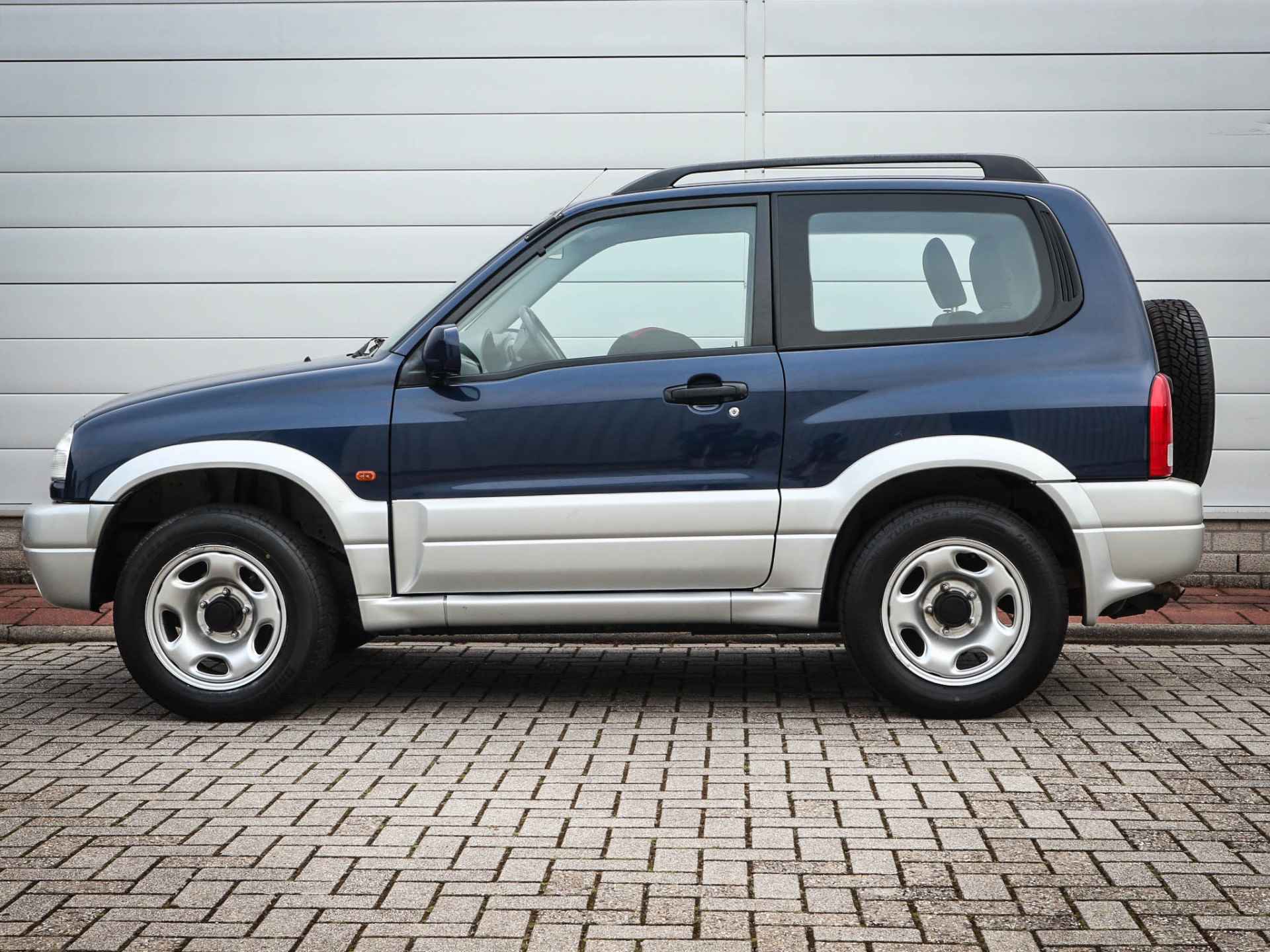 Suzuki Grand Vitara 1.6 Metal Top Wide Body | Audio | Elektrische ramen | Two tone kleur | Centrale vergrendeling | - 10/41