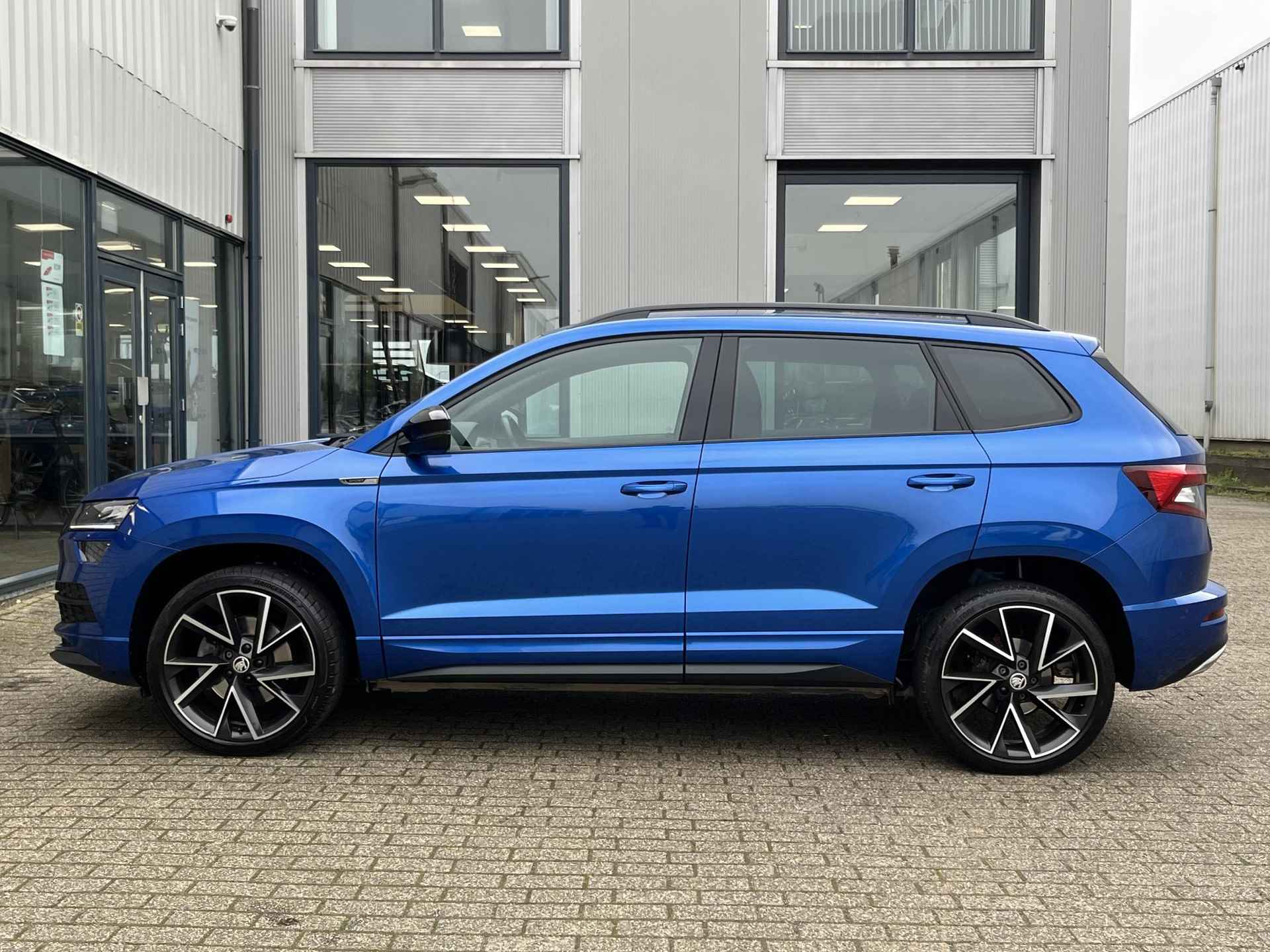 Skoda Karoq 1.5 TSI ACT Sportline Business | 1e Eig./Voll. Historie/Navi/Clima/Adapt.Cruise/Camera/19"/Sportstoelen/El. Wegklapbare Trehaak/Apple Carplay-Android Auto - 59/104