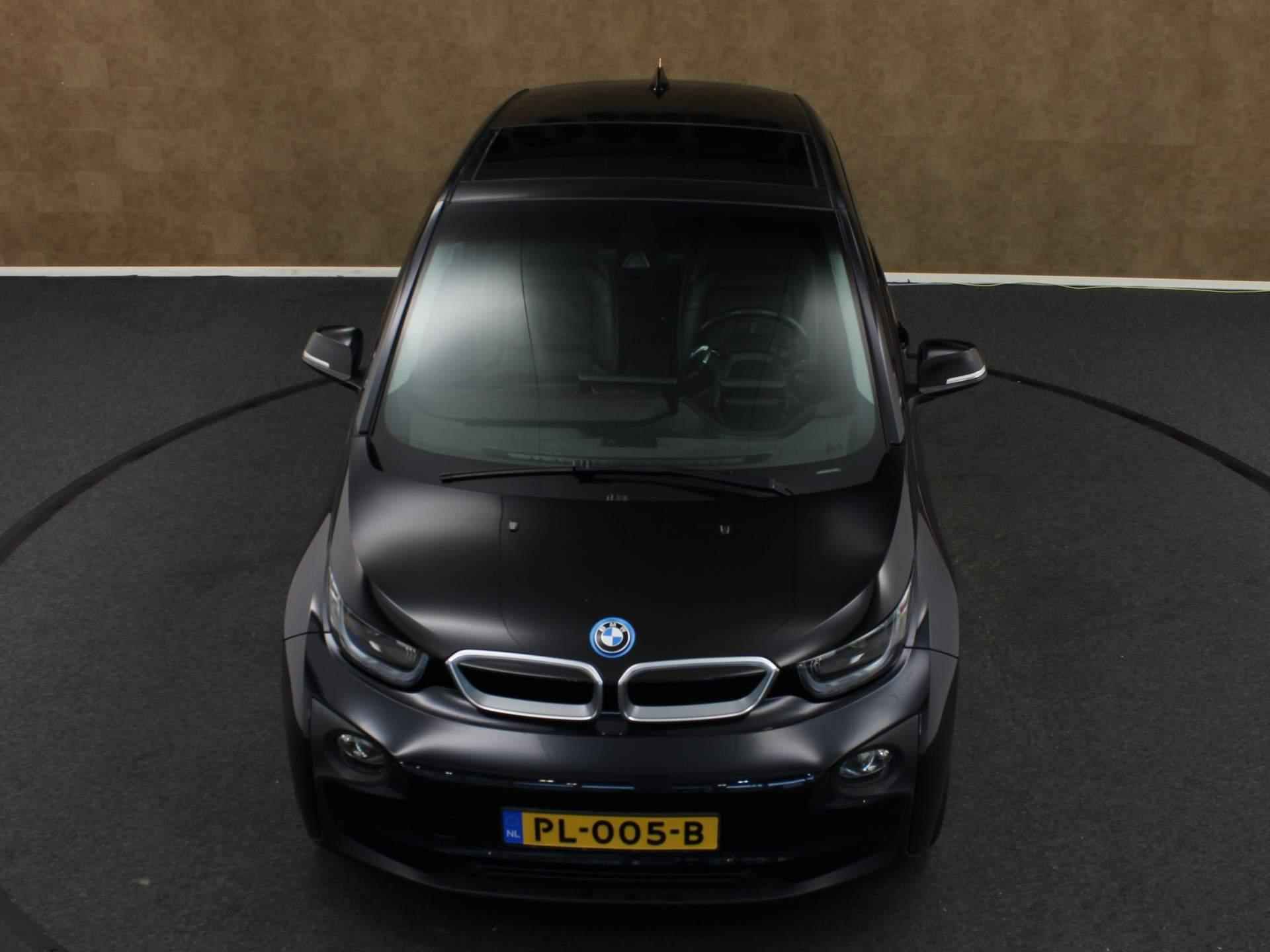 BMW i3 Basis 94Ah 33 kWh - ORIGINEEL NEDERLANDSE AUTO - CRUISE CONTROL - NAVIGATIESYSTEEM - LEDEREN BEKLEDING - ACHTERRUITRIJCAMERA - MULTIMEDIAVOORBEREIDING - HOUTEN AFWERKING - 12/40