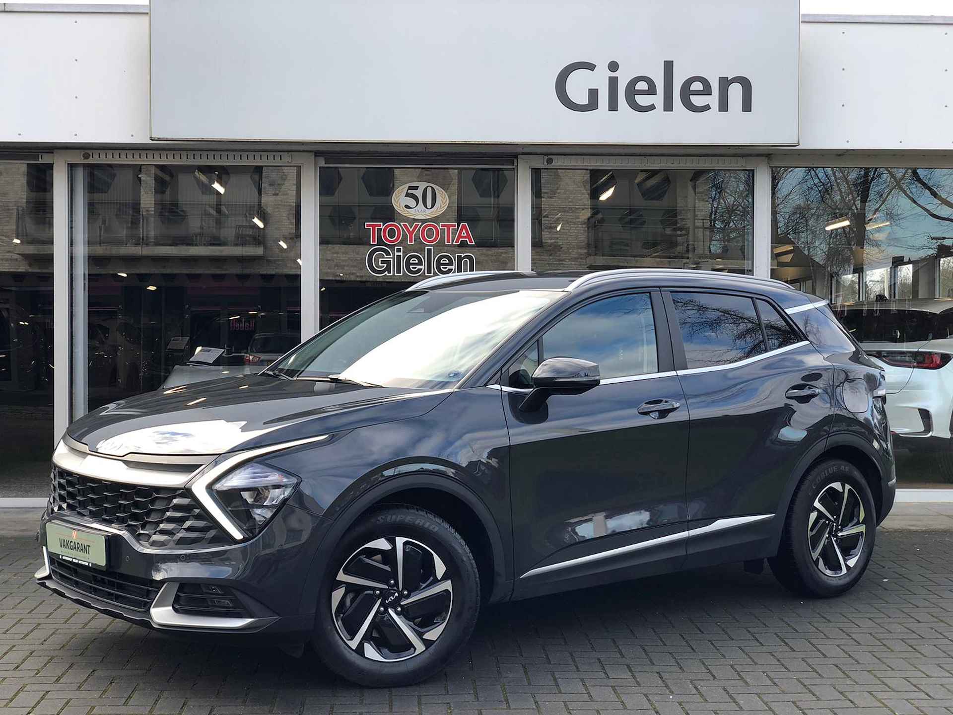 Kia Sportage 1.6 T-GDi MHEV Dynamicline | Trekhaak, Stoel + Stuurverwarming, Navigatie, CarPlay, Parkeersensoren - 1/39