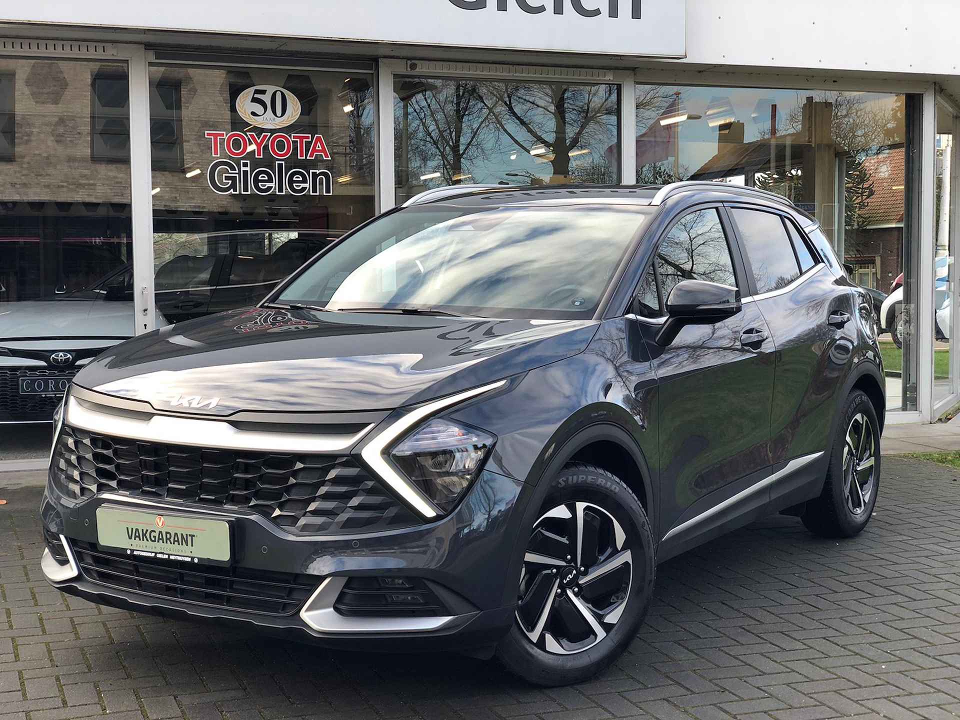 Kia Sportage 1.6 T-GDi MHEV Dynamicline | Trekhaak, Stoel + Stuurverwarming, Navigatie, CarPlay, Parkeersensoren - 2/39