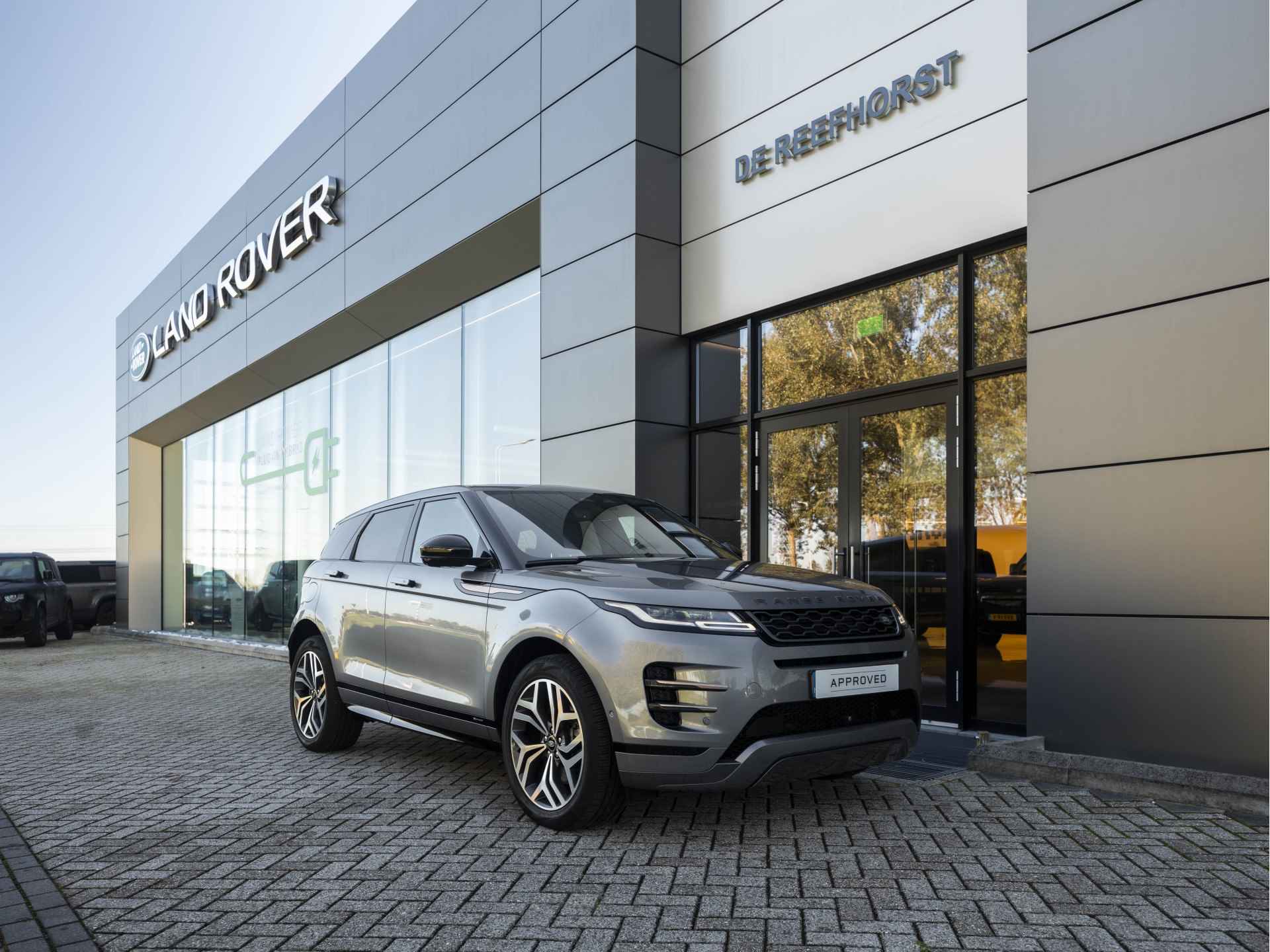 Land Rover Range Rover Evoque P300e AWD R-Dynamic SE | Elektrische trekhaak | Light Cloud | Adaptive Cruise | Ambianceverlichting - 14/61