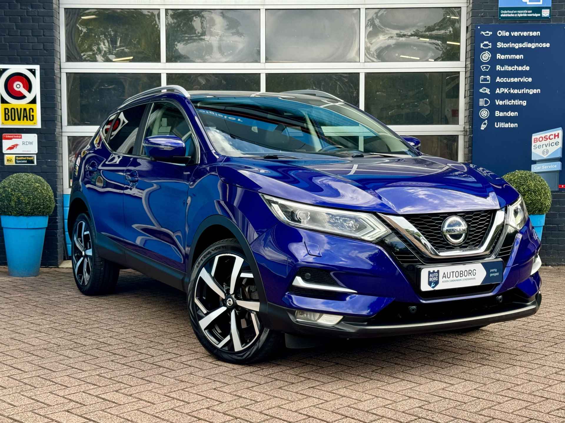 Nissan QASHQAI 1.3 DIG-T Design Edition | 360 Camera | Apple Carplay | Uitparkeer waarschuwing | Navi | Keyless entry | Dodehoek detector | Autonomous Emergency Braking | Rijklaar + 12 maanden Bovag garantie - 33/39