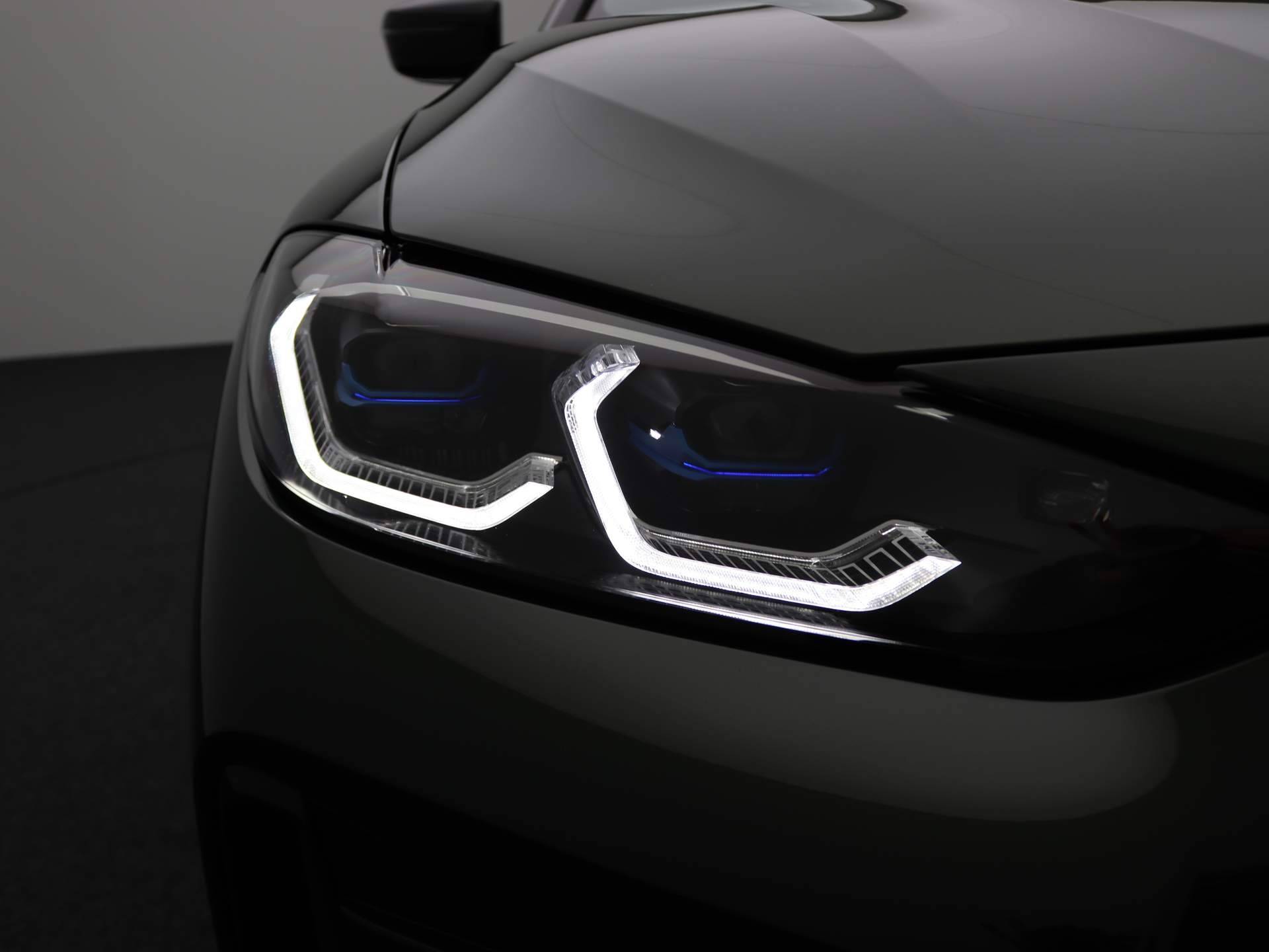 BMW 4 Serie Coupé M440i xDrive High Executive M Sportpakket / Schuifdak / Head-Up Display / Laserlight / Adaptief M Onderstel / 19'' - 34/36