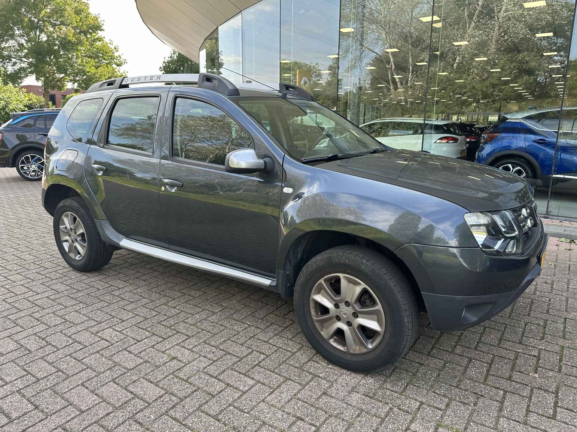 Dacia Duster 1.2 TCe 125 Prestige | 1e eigenaar! | PDC | Navi | Airco | Cruise | LM velgen 16" - 6/15