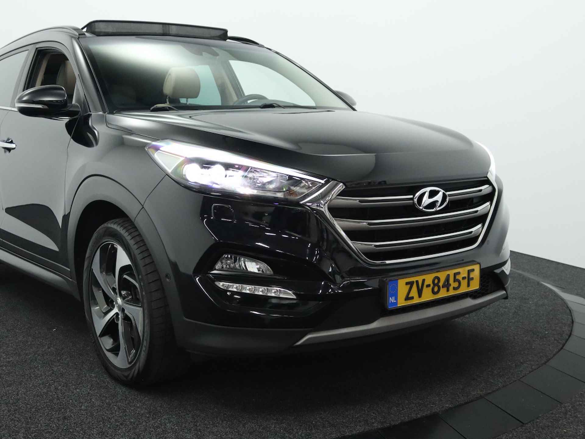 Hyundai Tucson 1.6 Premium Sky 4WD | Panoramadak | Camera | Navigatie - 4/49