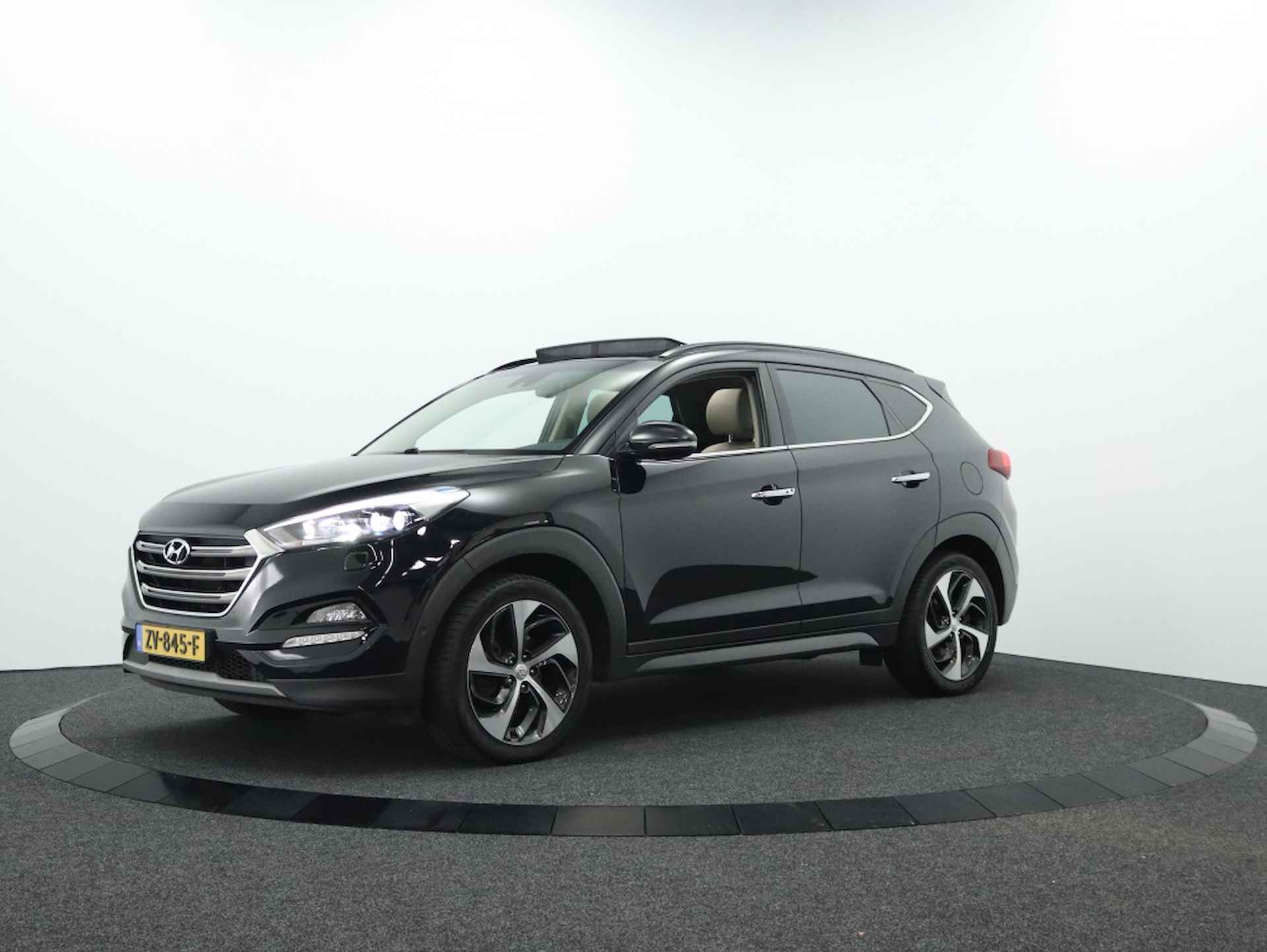 Hyundai Tucson 1.6 Premium Sky 4WD | Panoramadak | Camera | Navigatie - 16/49