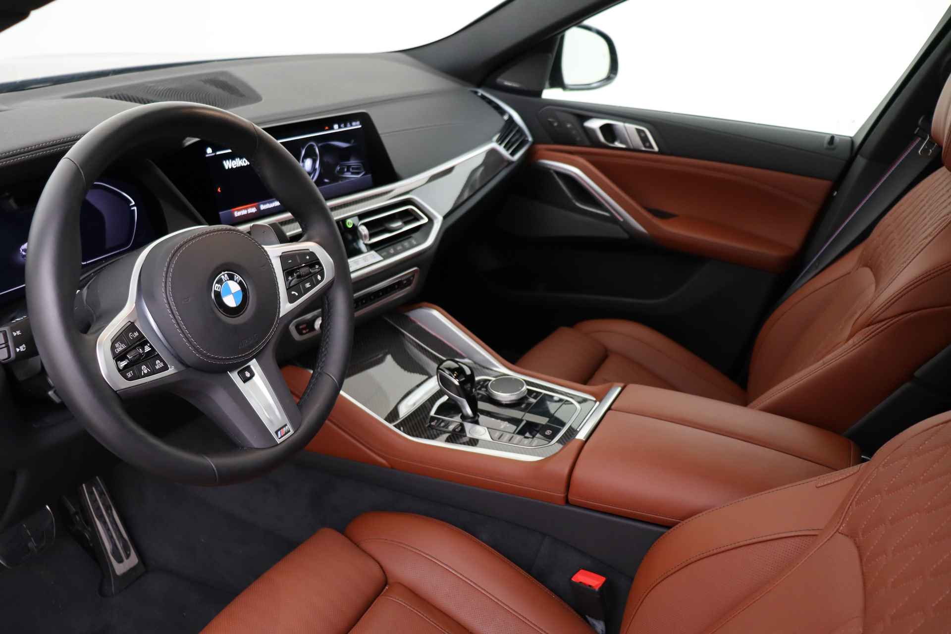 BMW X6 M50i High Executive Automaat / Panoramadak Sky Lounge / Adaptief M Onderstel Professional / Massagefunctie / Laserlight / Trekhaak / Active Steering / Soft-Close - 7/94