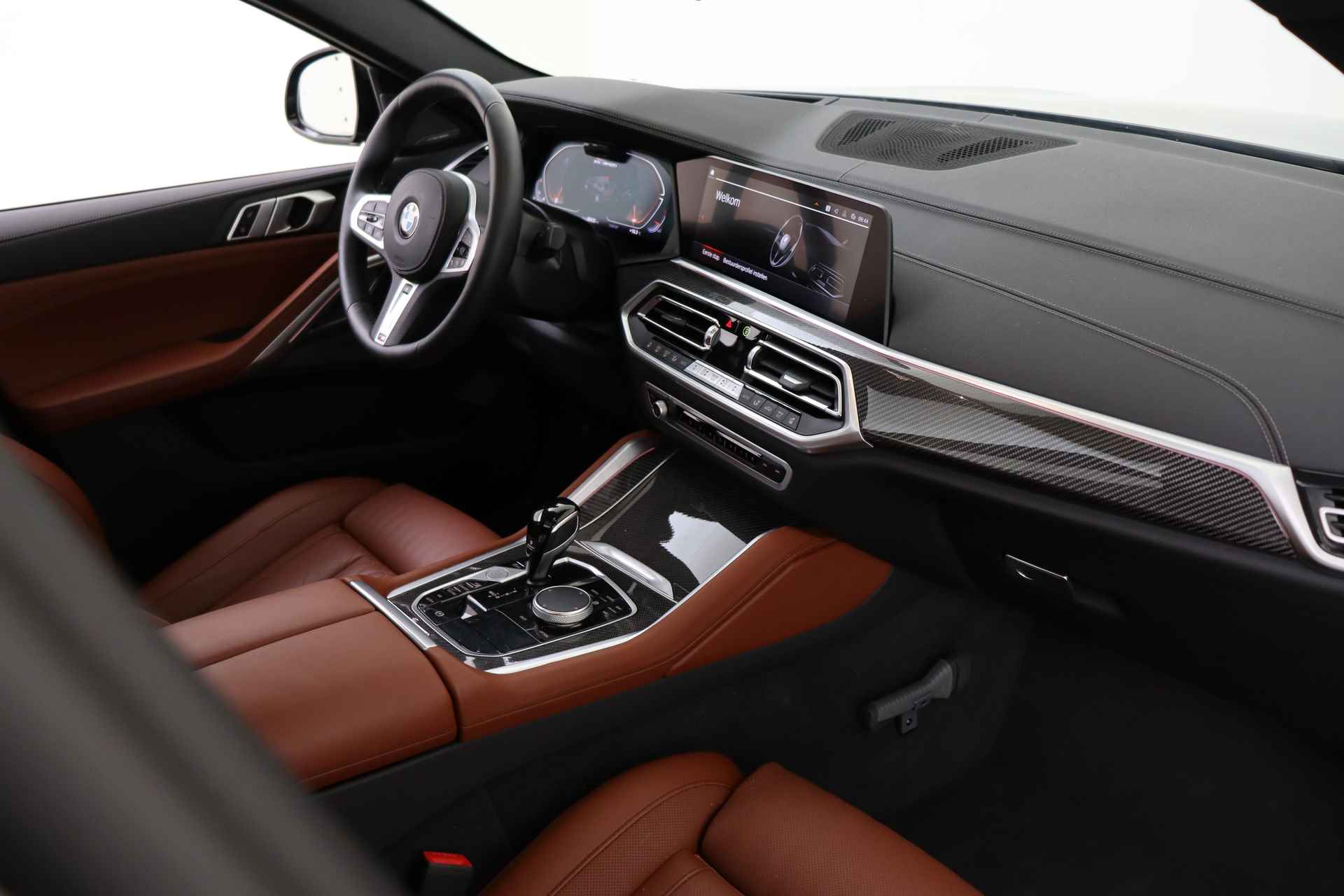 BMW X6 M50i High Executive Automaat / Panoramadak Sky Lounge / Adaptief M Onderstel Professional / Massagefunctie / Laserlight / Trekhaak / Active Steering / Soft-Close - 13/94