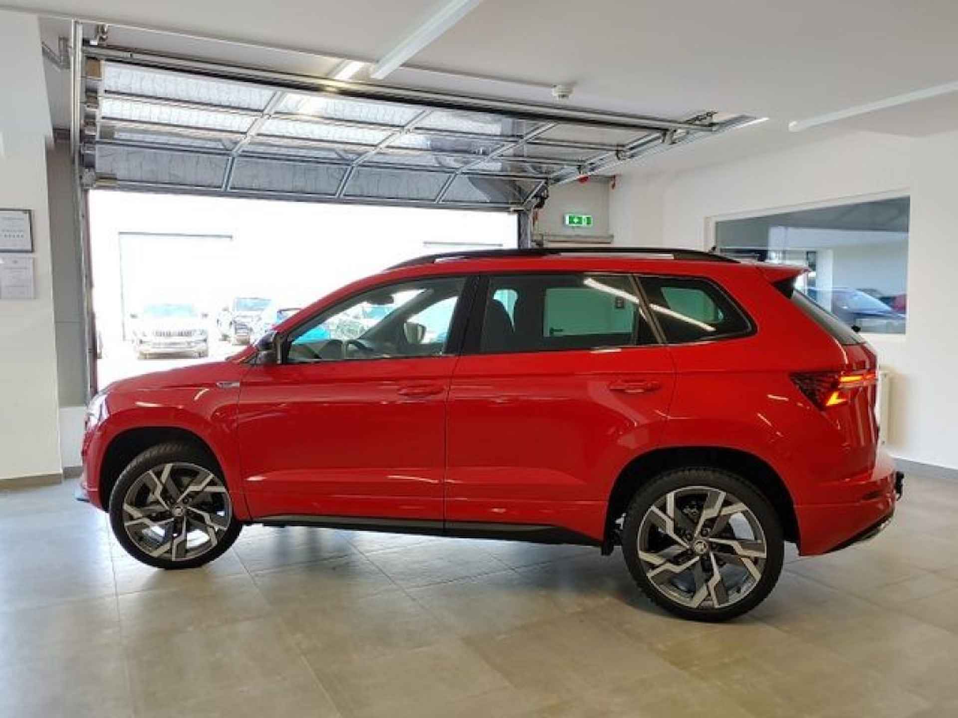 SKODA Karoq 1.5 TSI DSG SPORTLINE PANO-DAK/TREKHAAK/CAMERA/NAVI/STOELVERW - 5/16