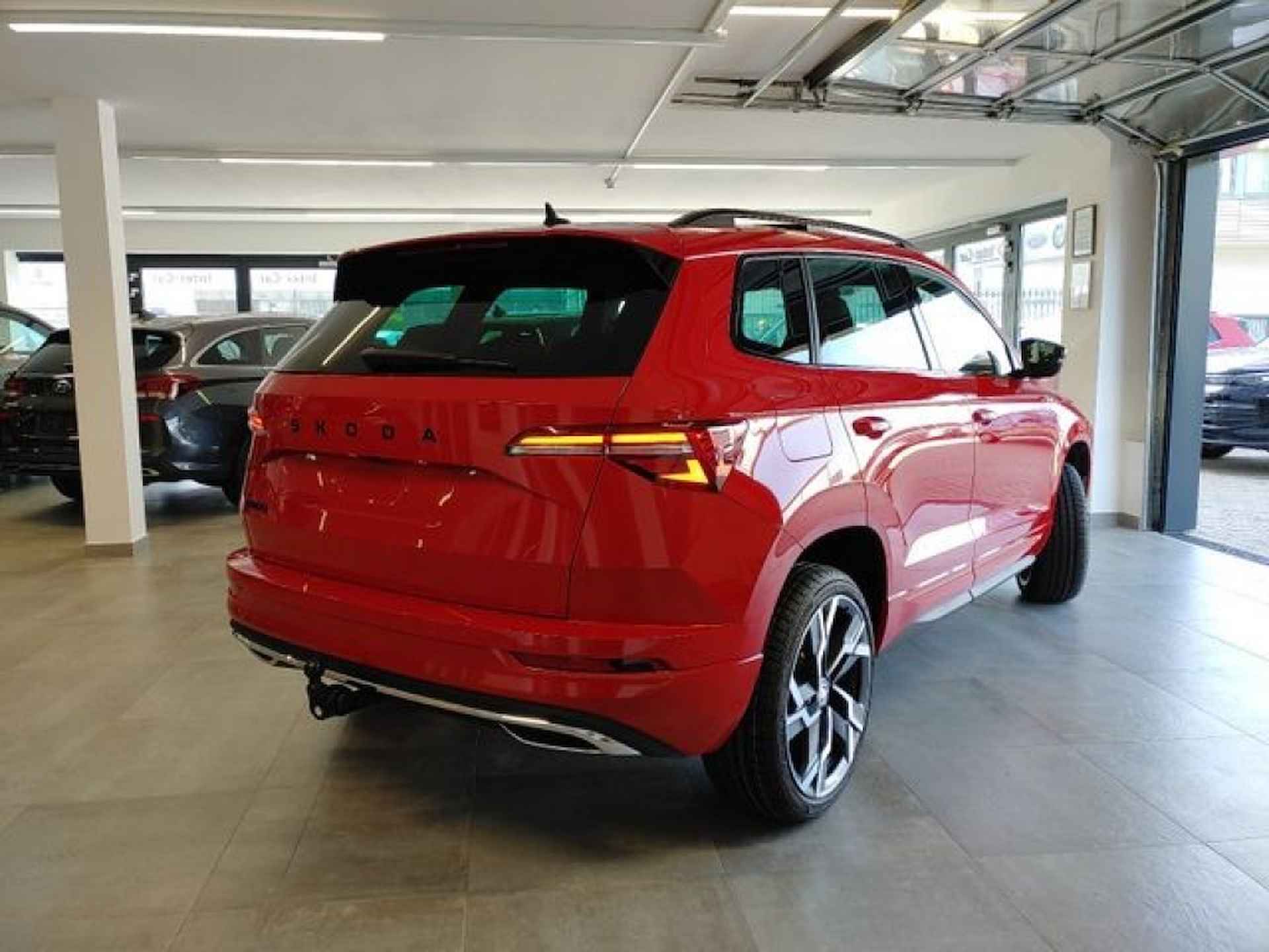 SKODA Karoq 1.5 TSI DSG SPORTLINE PANO-DAK/TREKHAAK/CAMERA/NAVI/STOELVERW - 6/16