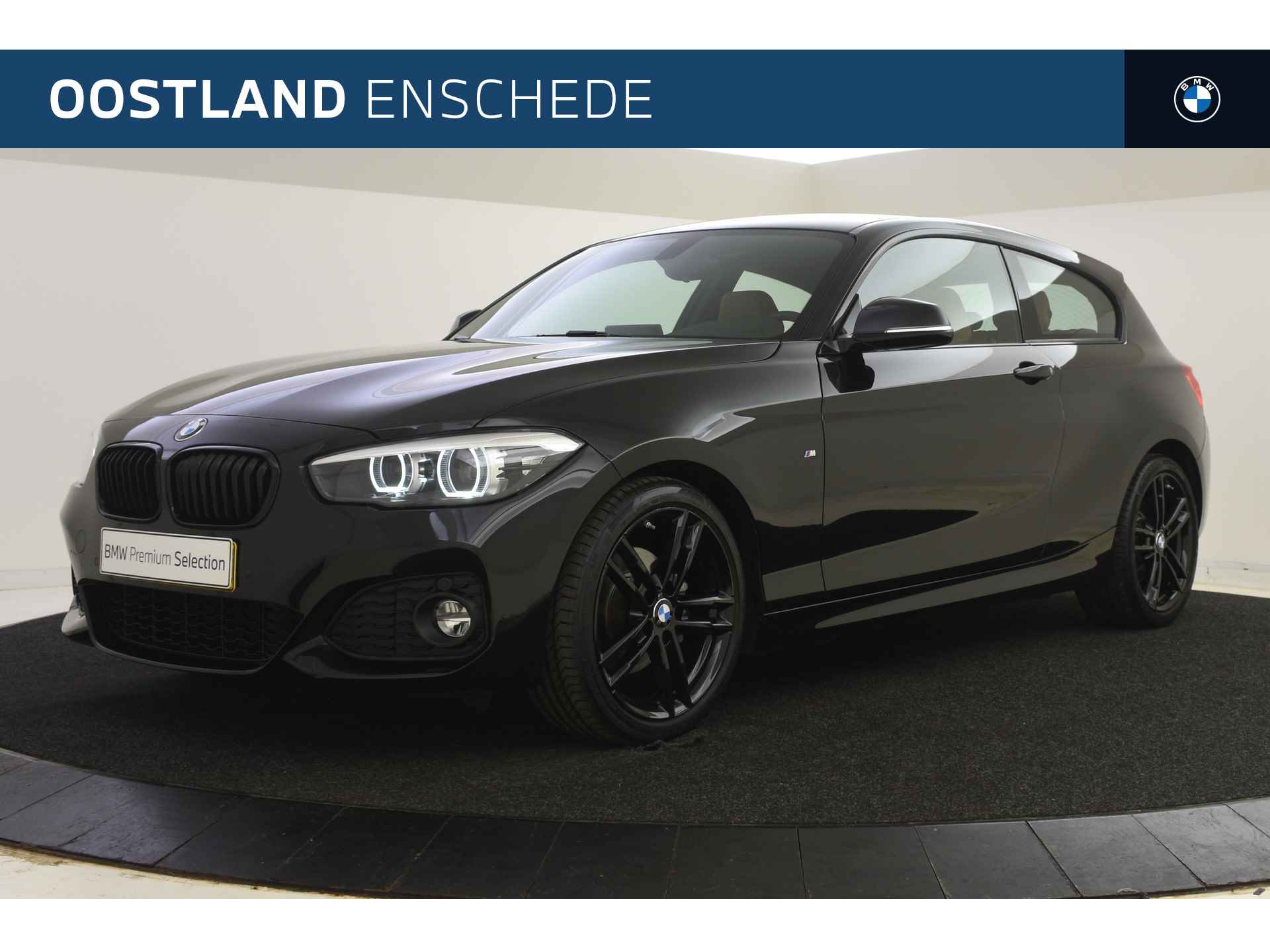 BMW 1-serie 120i High Executive Automaat / Sportstoelen / LED / M Sportonderstel / Stoelverwarming / PDC voor + achter / Navigatie Professional - 1/45