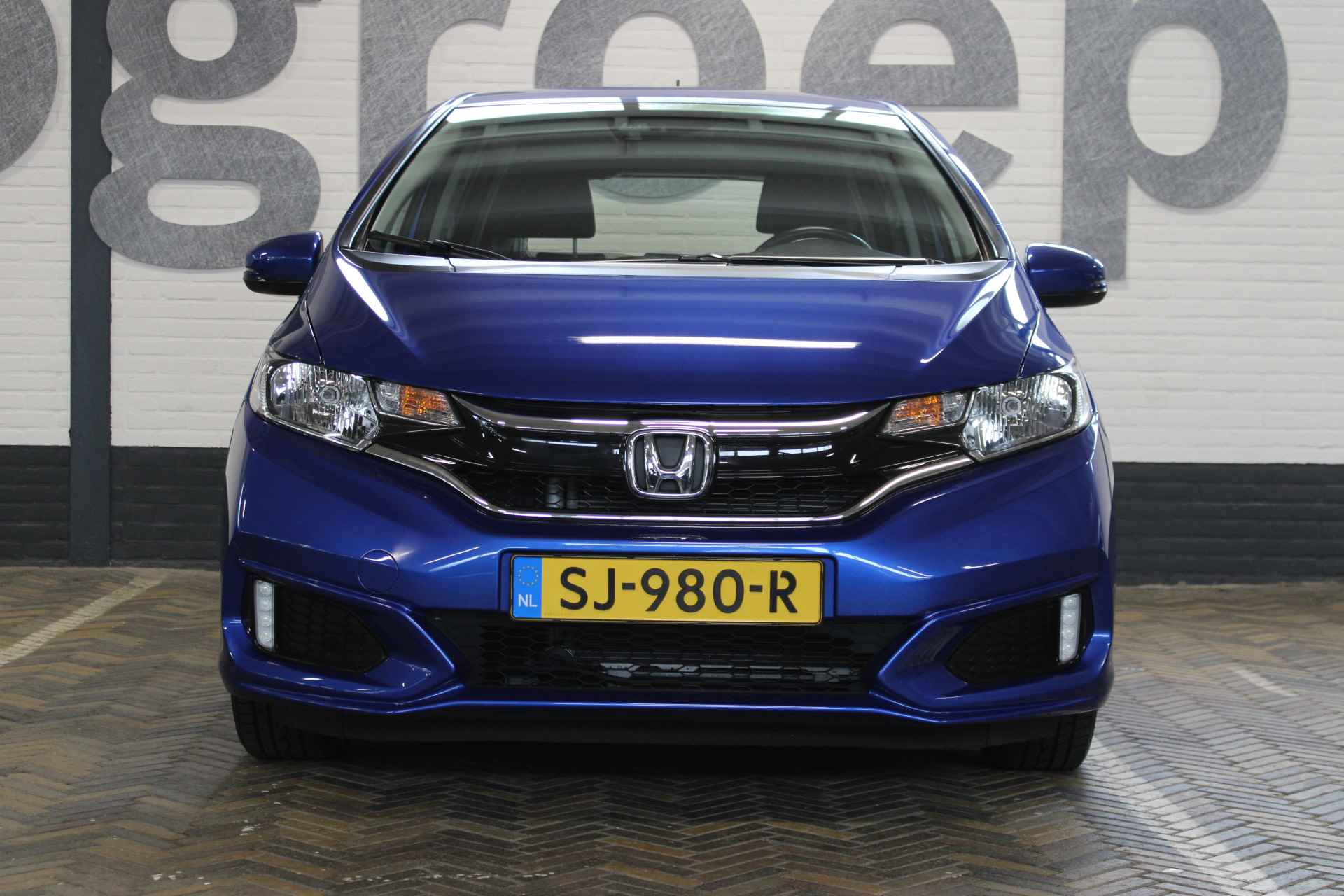 Honda Jazz 1.3 i-VTEC Trend | Incl. 12 maanden garantie | 100% dealeronderhouden | Cruise control | Airco | Radio | Automaat | Stoelverwarming | Parkeersensoren | Bluetooth | - 18/50