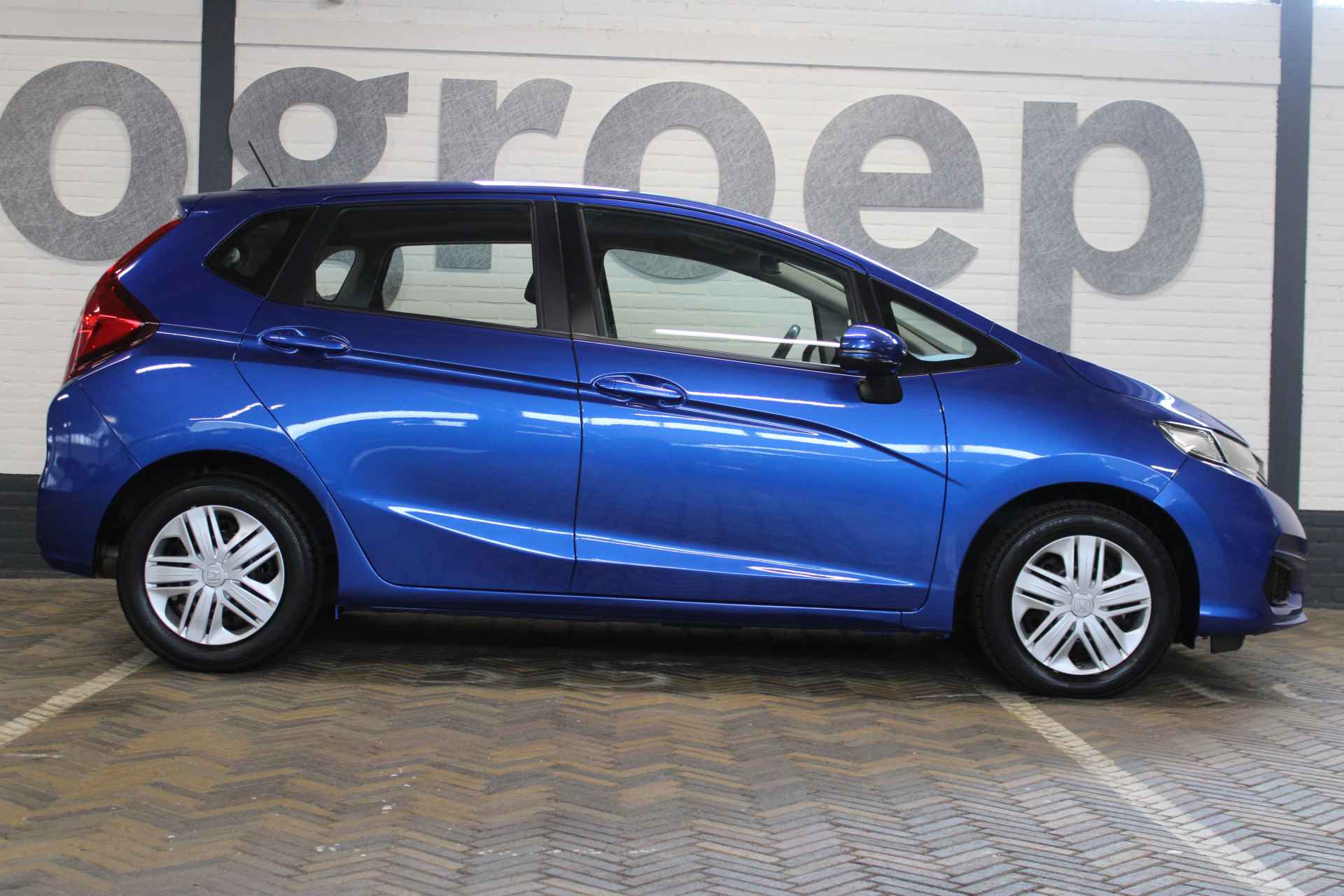 Honda Jazz 1.3 i-VTEC Trend | Incl. 12 maanden garantie | 100% dealeronderhouden | Cruise control | Airco | Radio | Automaat | Stoelverwarming | Parkeersensoren | Bluetooth | - 20/50