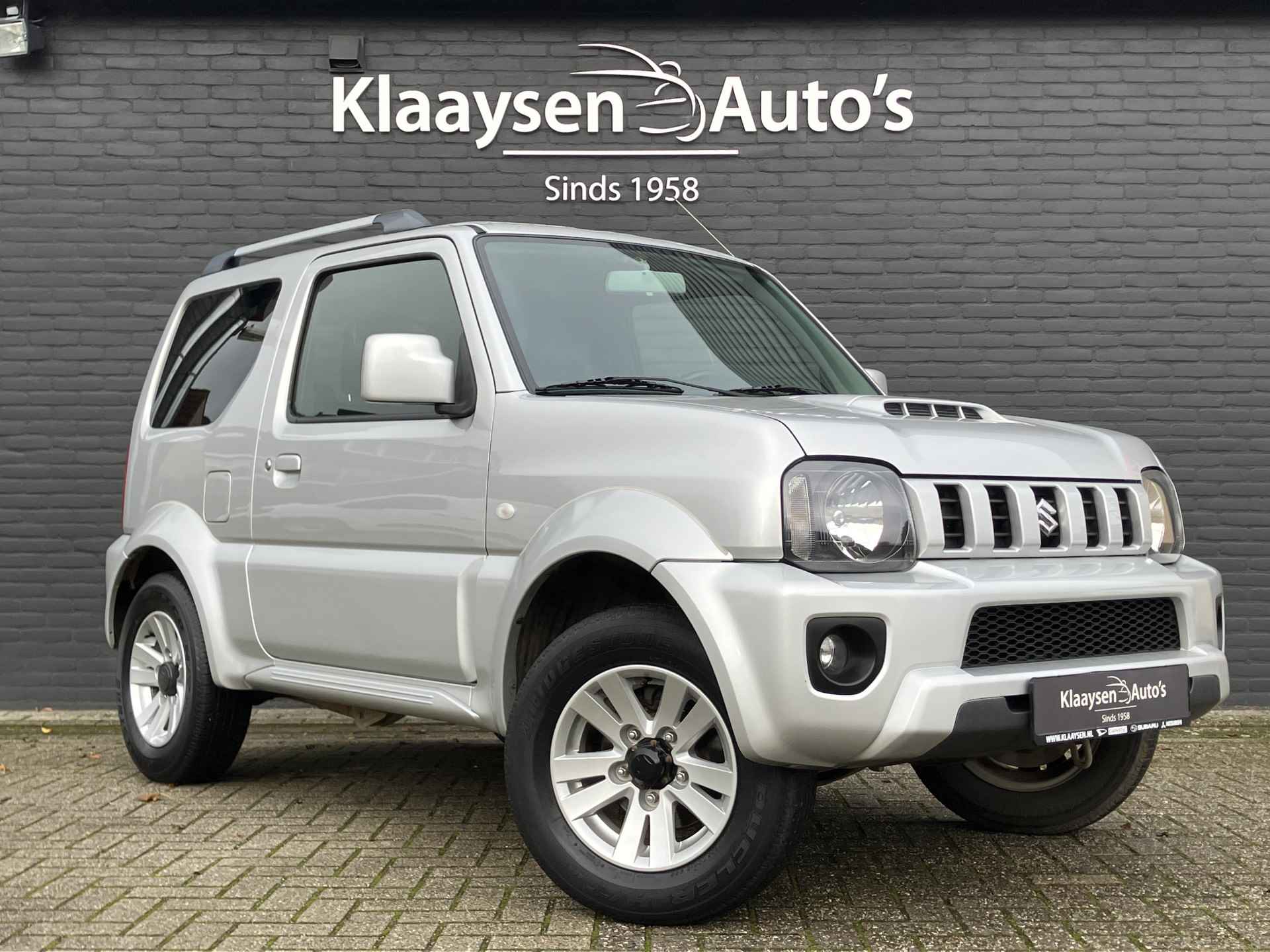 Suzuki Jimny 1.3 Exclusive 4WD | dealer onderhouden | airco | leder interieur | trekhaak | stoelverwarming | dakrails - 4/29