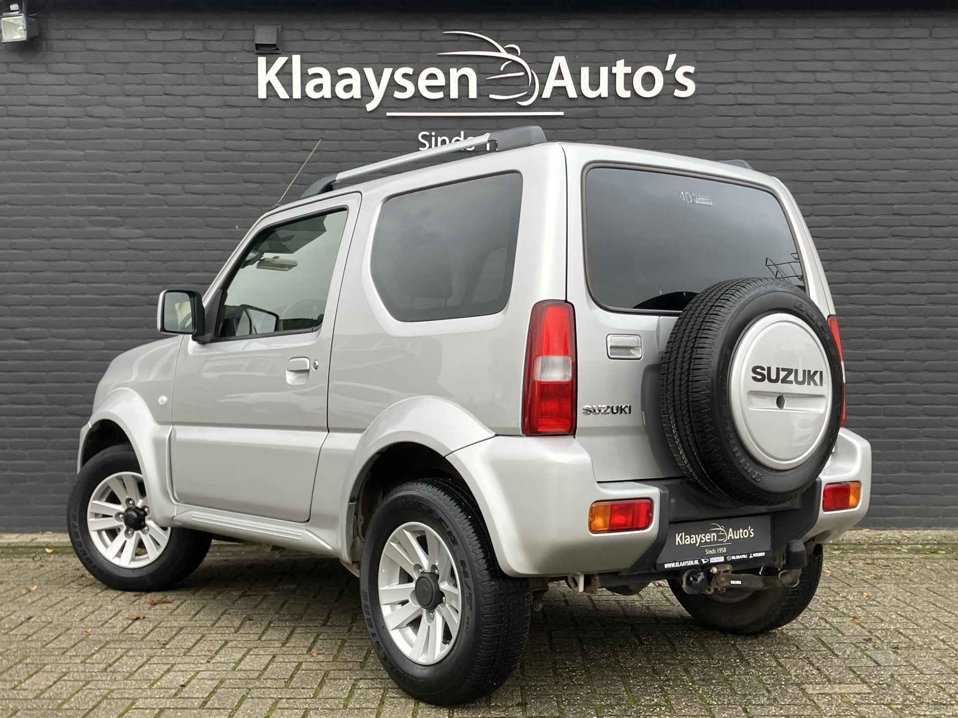 Suzuki Jimny 1.3 Exclusive 4WD | dealer onderhouden | airco | leder interieur | trekhaak | stoelverwarming | dakrails - 8/29