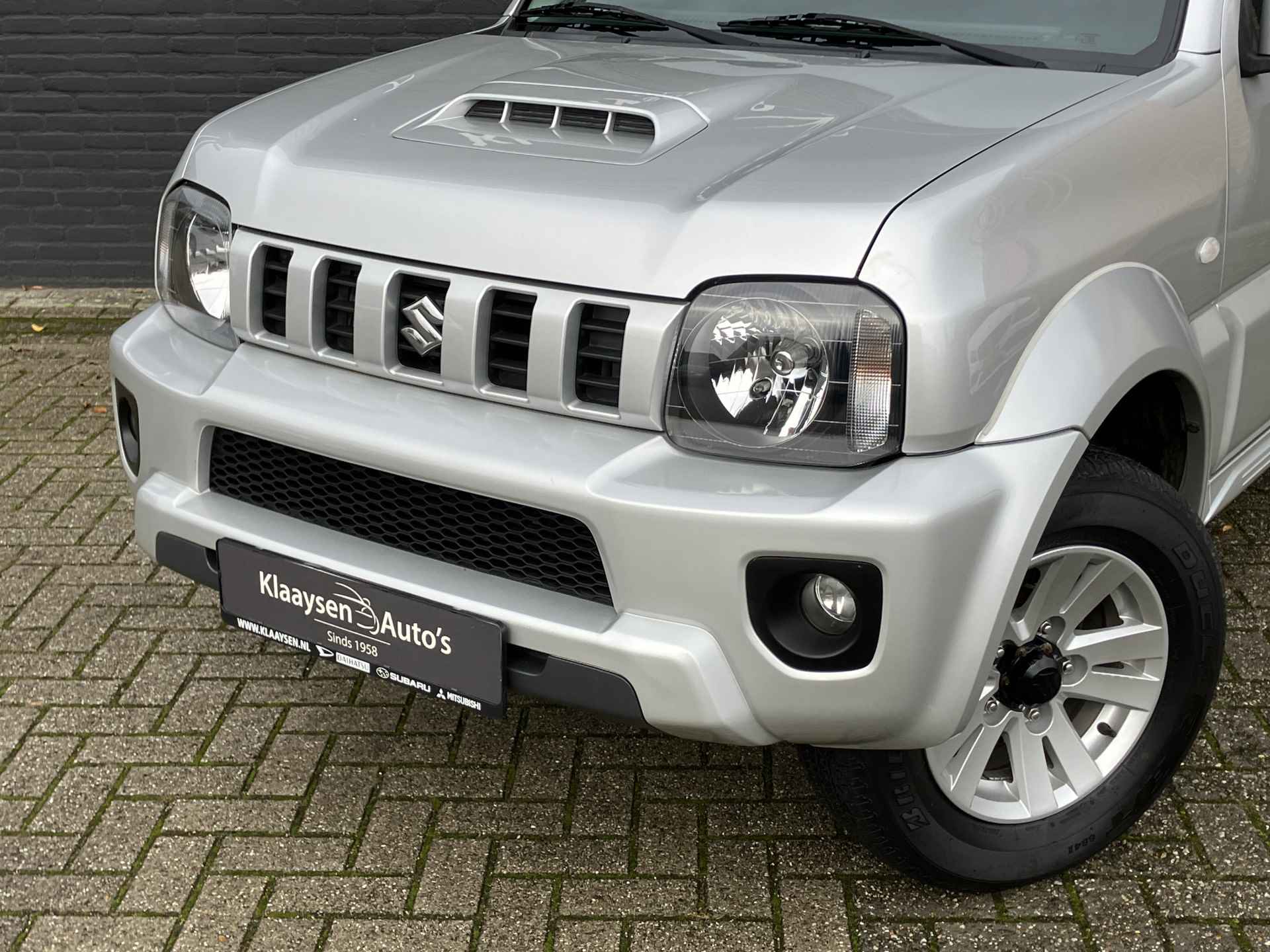 Suzuki Jimny 1.3 Exclusive 4WD | dealer onderhouden | airco | leder interieur | trekhaak | stoelverwarming | dakrails - 12/29