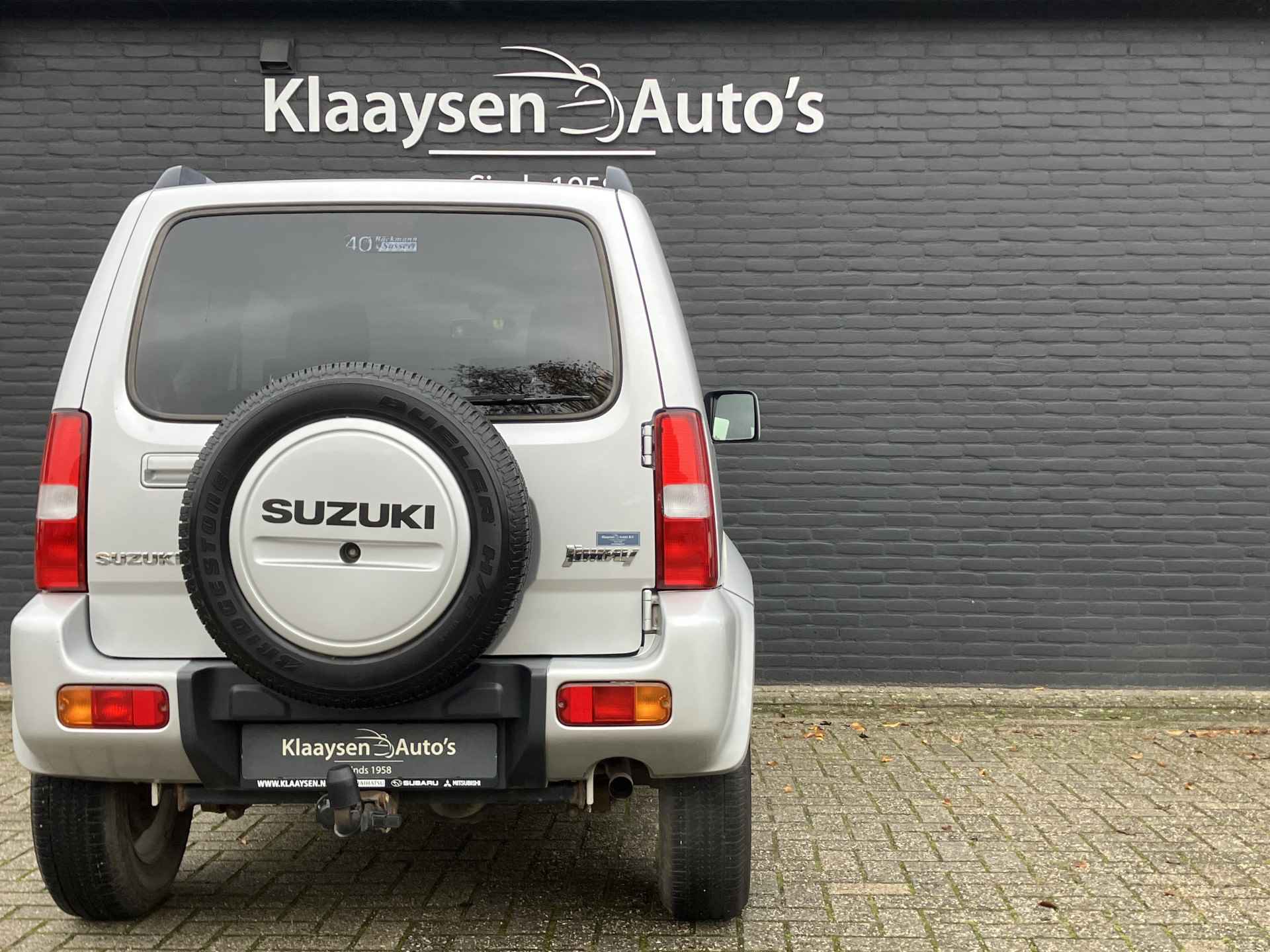 Suzuki Jimny 1.3 Exclusive 4WD | dealer onderhouden | airco | leder interieur | trekhaak | stoelverwarming | dakrails - 13/29