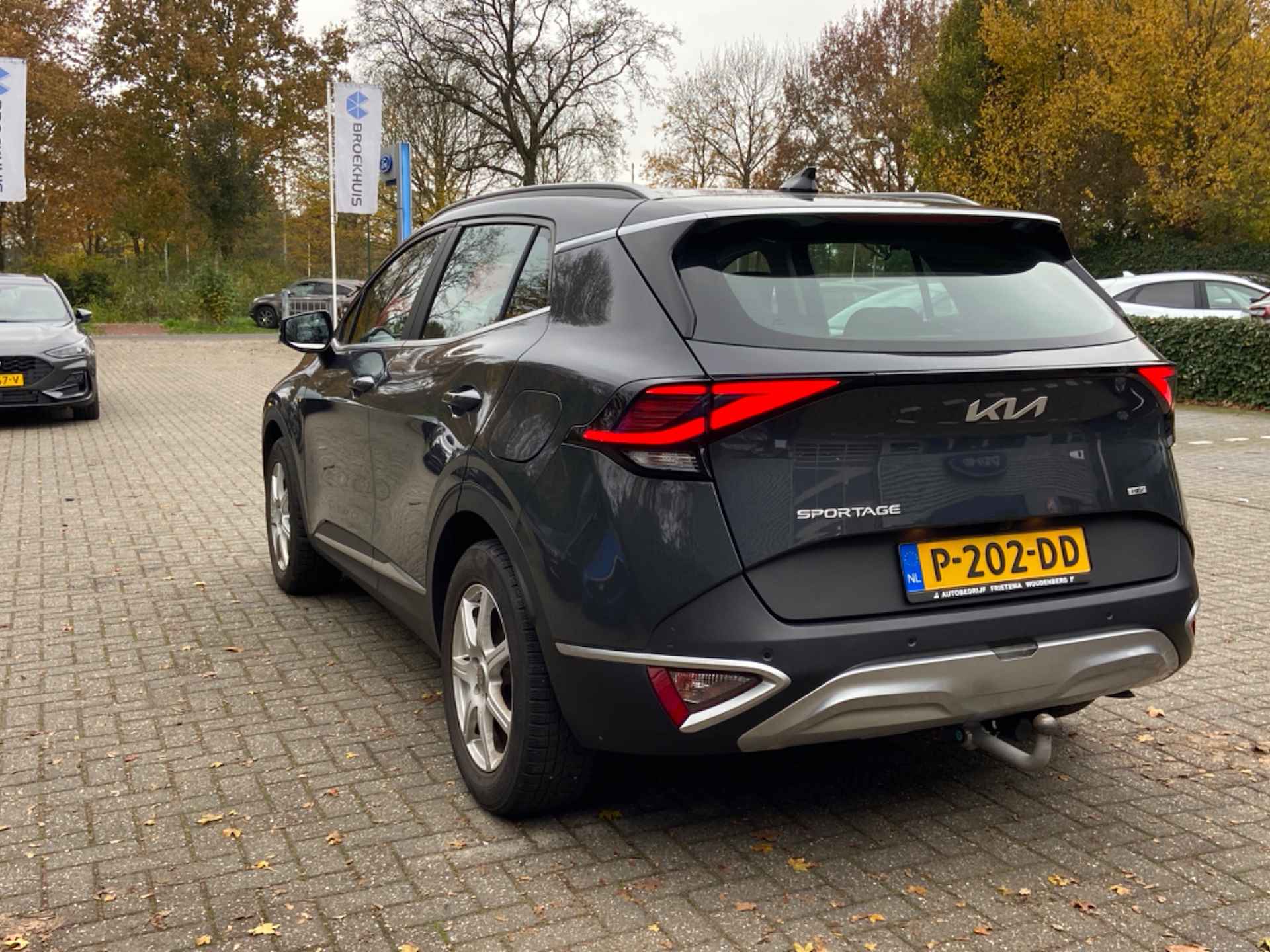 Kia Sportage 1.6 T-GDi Plug-In DynamicLine | NL-AUTO! | 1E EIGENAAR | ADAPTIVE CRUISE | CAMERA | TREKHAAK | WIDESCREEN | PARK SENS V+A | CLIM - 4/10