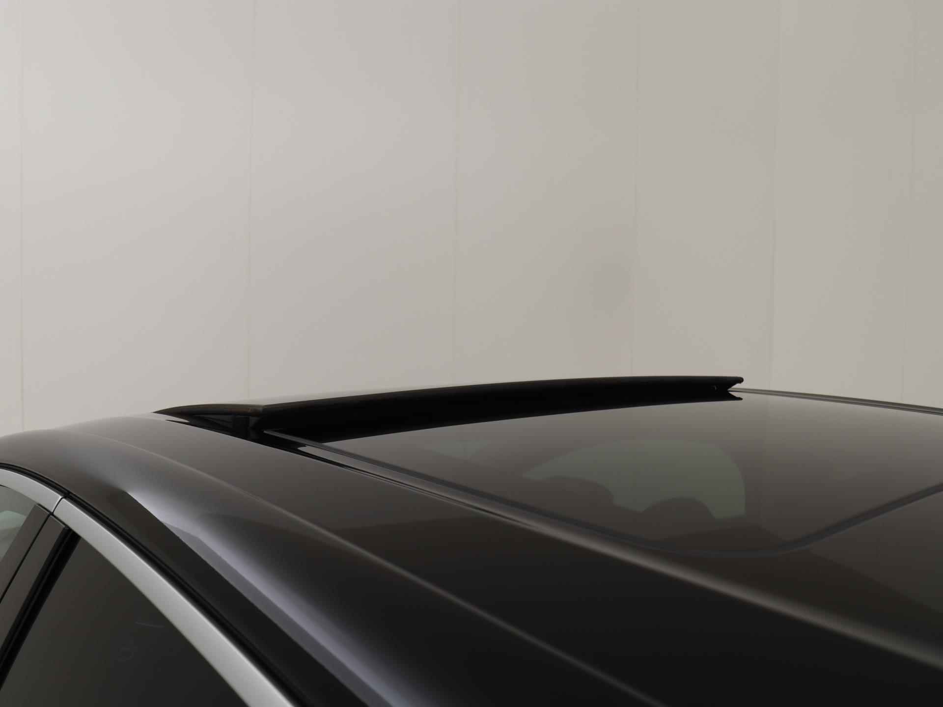 Nissan Ariya 87 kWh Evolve | Sunset Red | Duo-Tone | Panoramadak | Stoelventilatie - 28/31