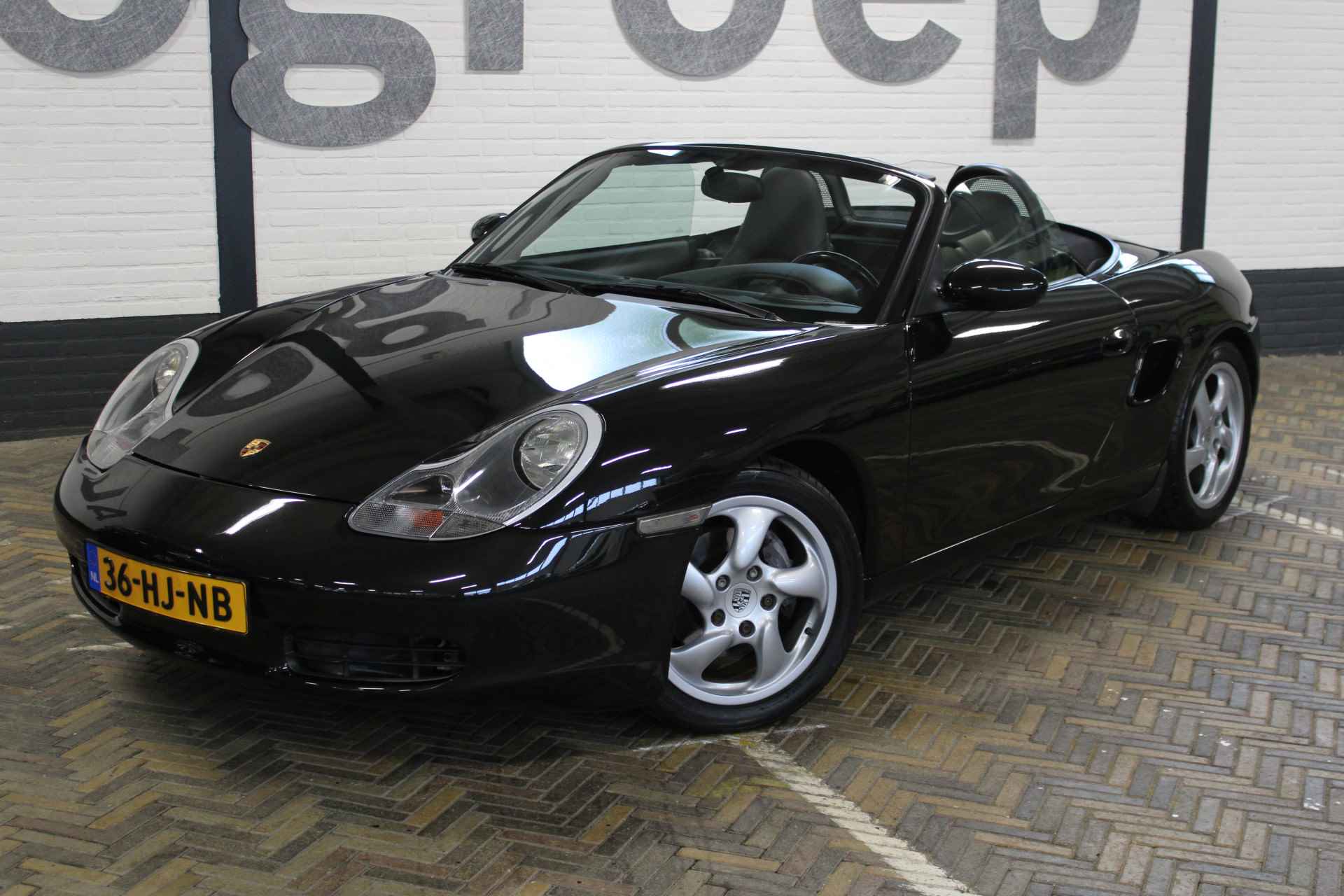 Porsche Boxster 2.7 | Hard en soft top dak | Elektrisch bedienbaar cabrio dak | Airco | Cruise | 16 Inch LMV | Half leder/alcantara bekleding | Origineel NL auto | NAP | - 7/51