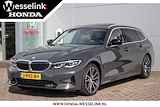 BMW 3 Serie Touring 318i Individual High Executive - All-in rijklrprs | prem audio | sportstoelen | Schuif/-kanteldak | Leer | Privacy glass