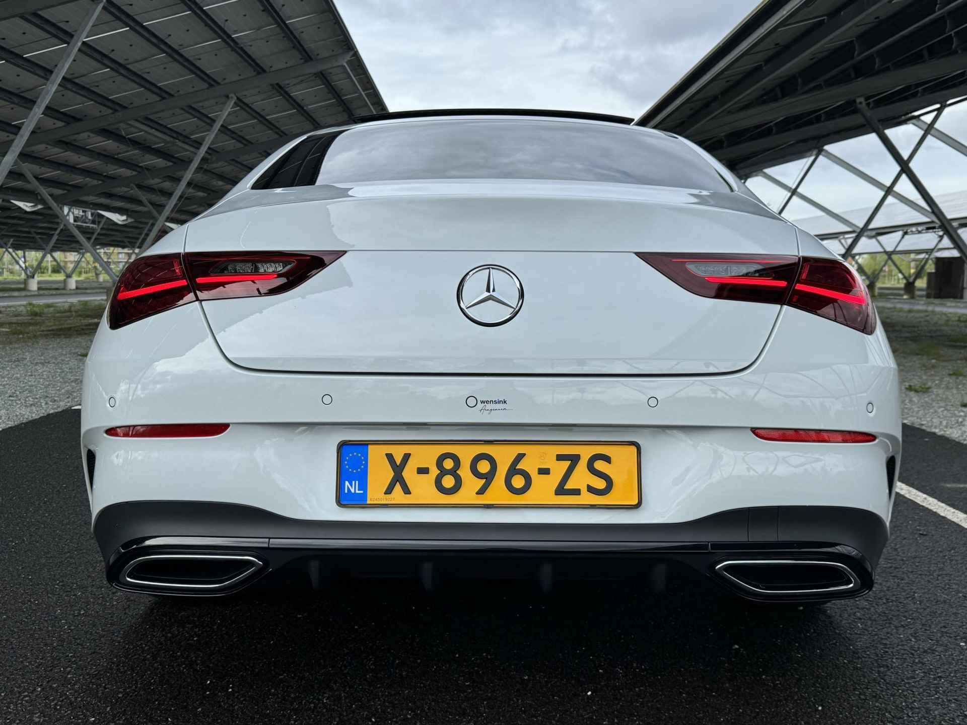 Mercedes-Benz CLA-klasse Coupe 180 AMG Line | Panorama-schuifdak | Parkeercamera | Stoelverwarming | Sfeerverlichting | - 7/32