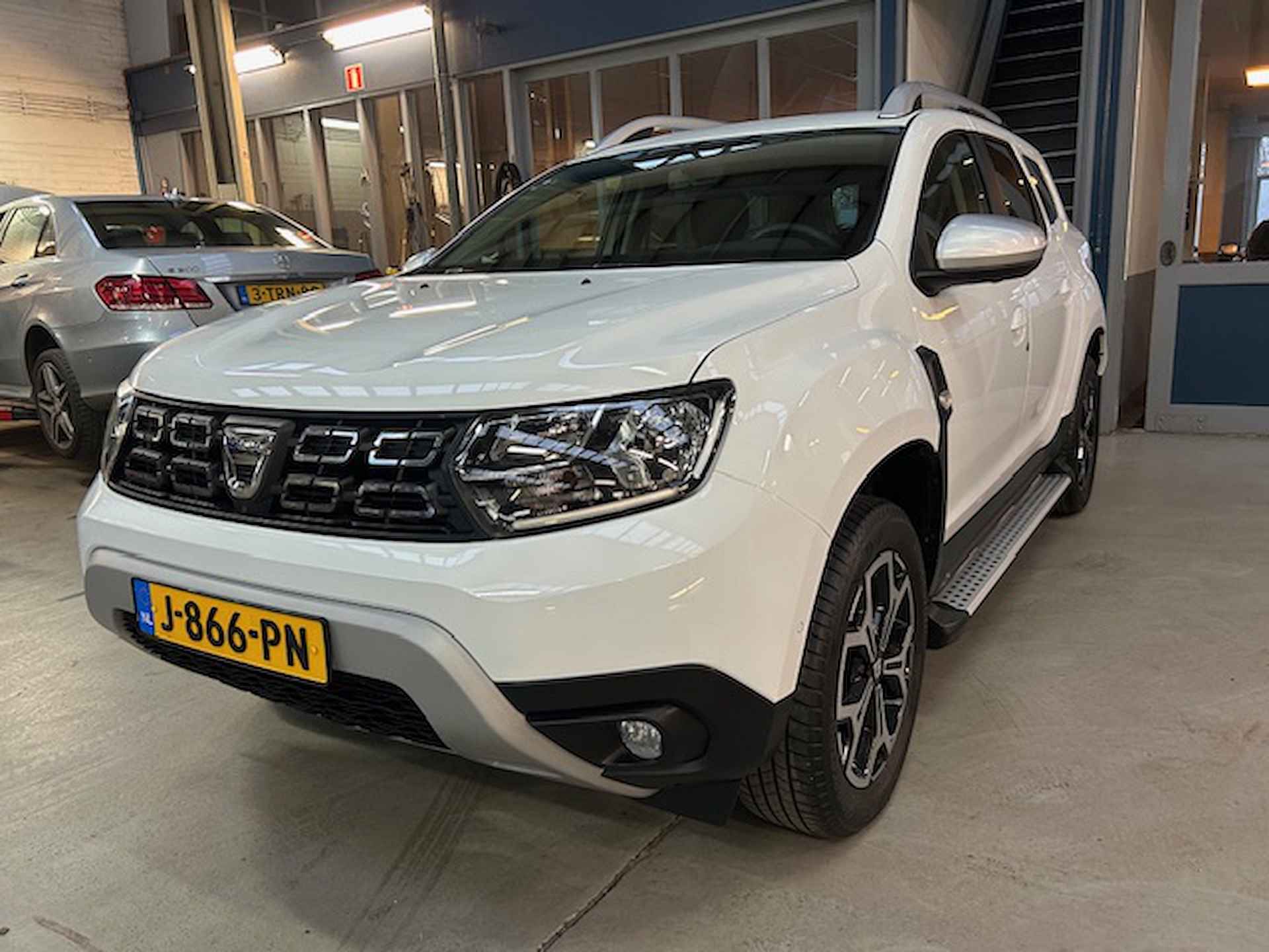 Dacia Duster 1.0 Tce 100pk 4x2 Prestige | Climate control | Sidebars | Navigatie | Camera | Pdc V+A  | Lm velgen | Cruise control | NAP | Rijklaar prijs! - 3/25