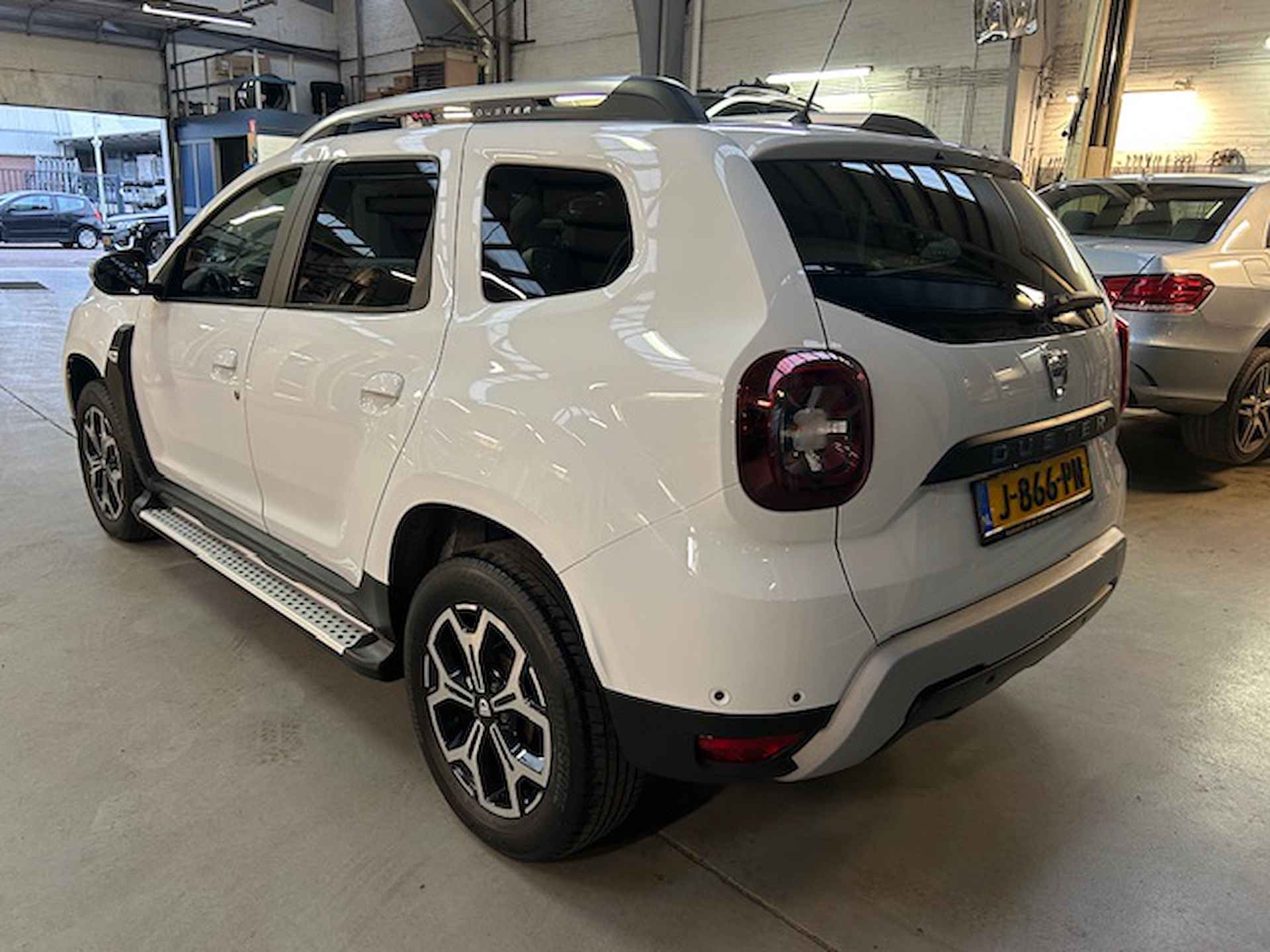 Dacia Duster 1.0 Tce 100pk 4x2 Prestige | Climate control | Sidebars | Navigatie | Camera | Pdc V+A  | Lm velgen | Cruise control | NAP | Rijklaar prijs! - 5/25