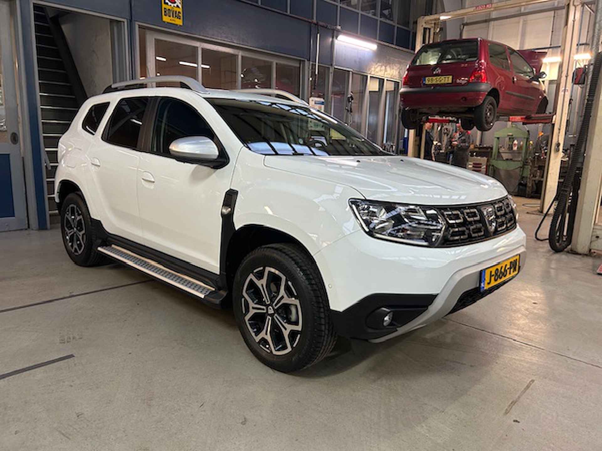 Dacia Duster 1.0 Tce 100pk 4x2 Prestige | Climate control | Sidebars | Navigatie | Camera | Pdc V+A  | Lm velgen | Cruise control | NAP | Rijklaar prijs! - 9/25