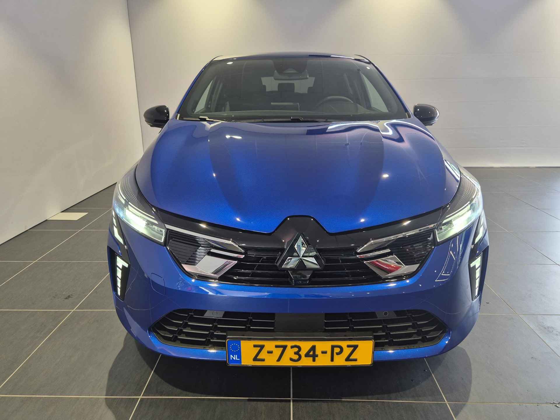 Mitsubishi Colt 1.6 HEV Instyle Hybrid | 8 Jaar garantie | Remklauwen in Carrosseriekleur | Zwart-Blauwe gordels | Full Options | Sportpedalen | Verlichte Instaplijsten | - 7/34