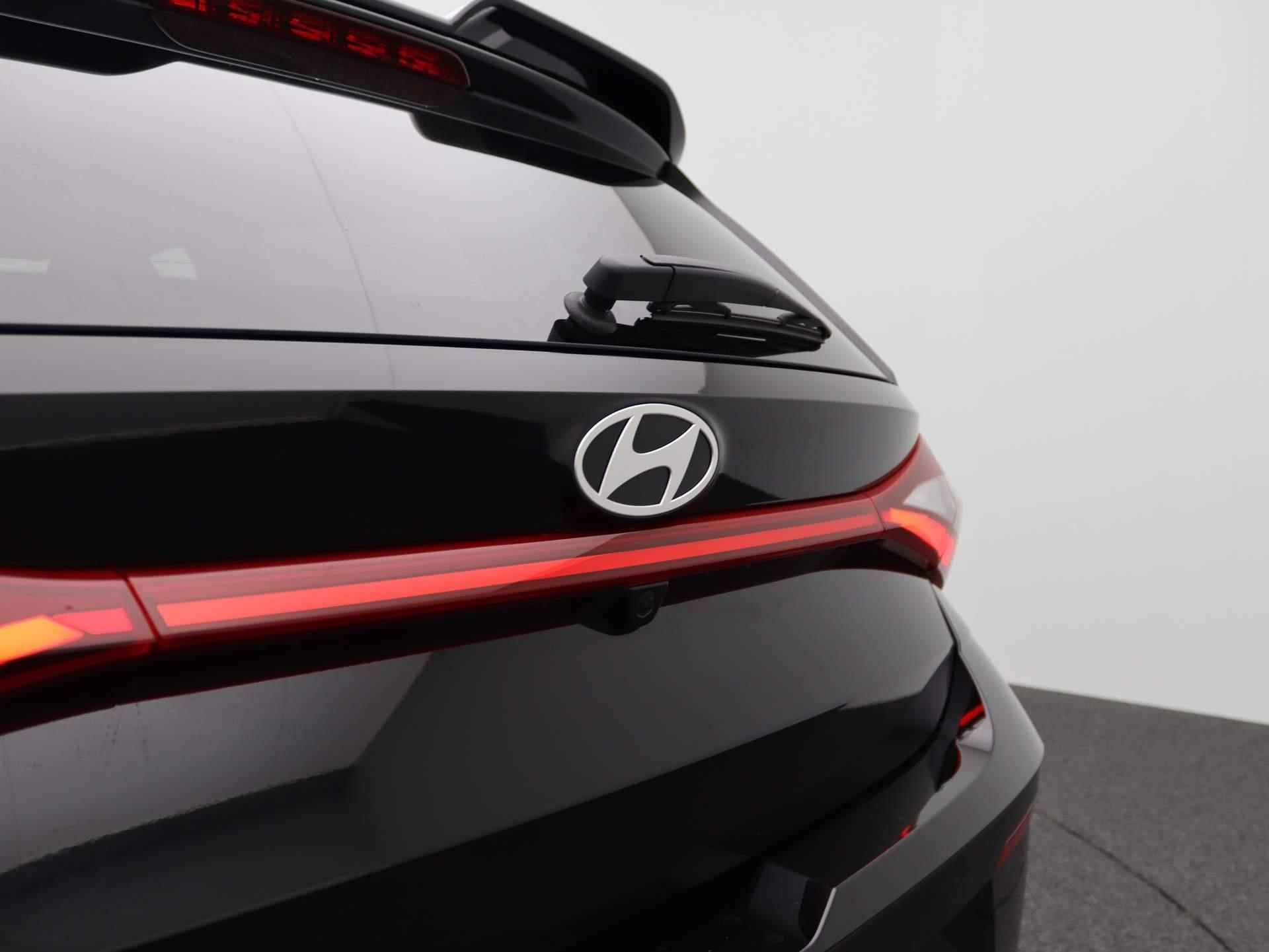 Hyundai i20 1.0 T-GDI Premium Sky | Rally Edition pakket | Schuif-/ Kantel dak | Stoelverwarming | Stuurverwarming | Bose | 18 Inch Lmv | - 36/48