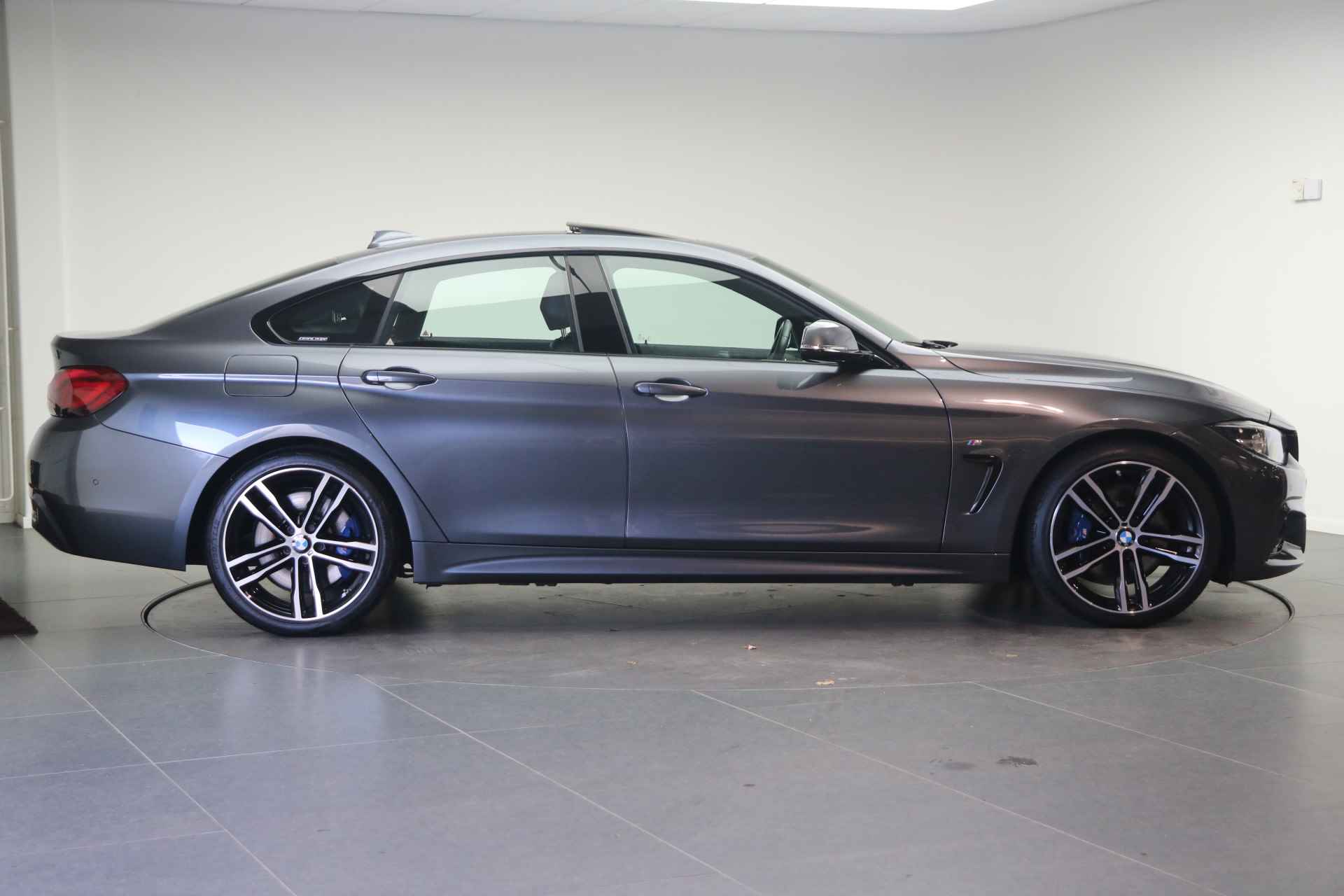 BMW 4 Serie Gran Coupé 420i High Executive M Sport Automaat / Schuif-kanteldak / Achteruitrijcamera / Sportstoelen / Head-Up / Park Assistant / Stoelverwarming - 5/27