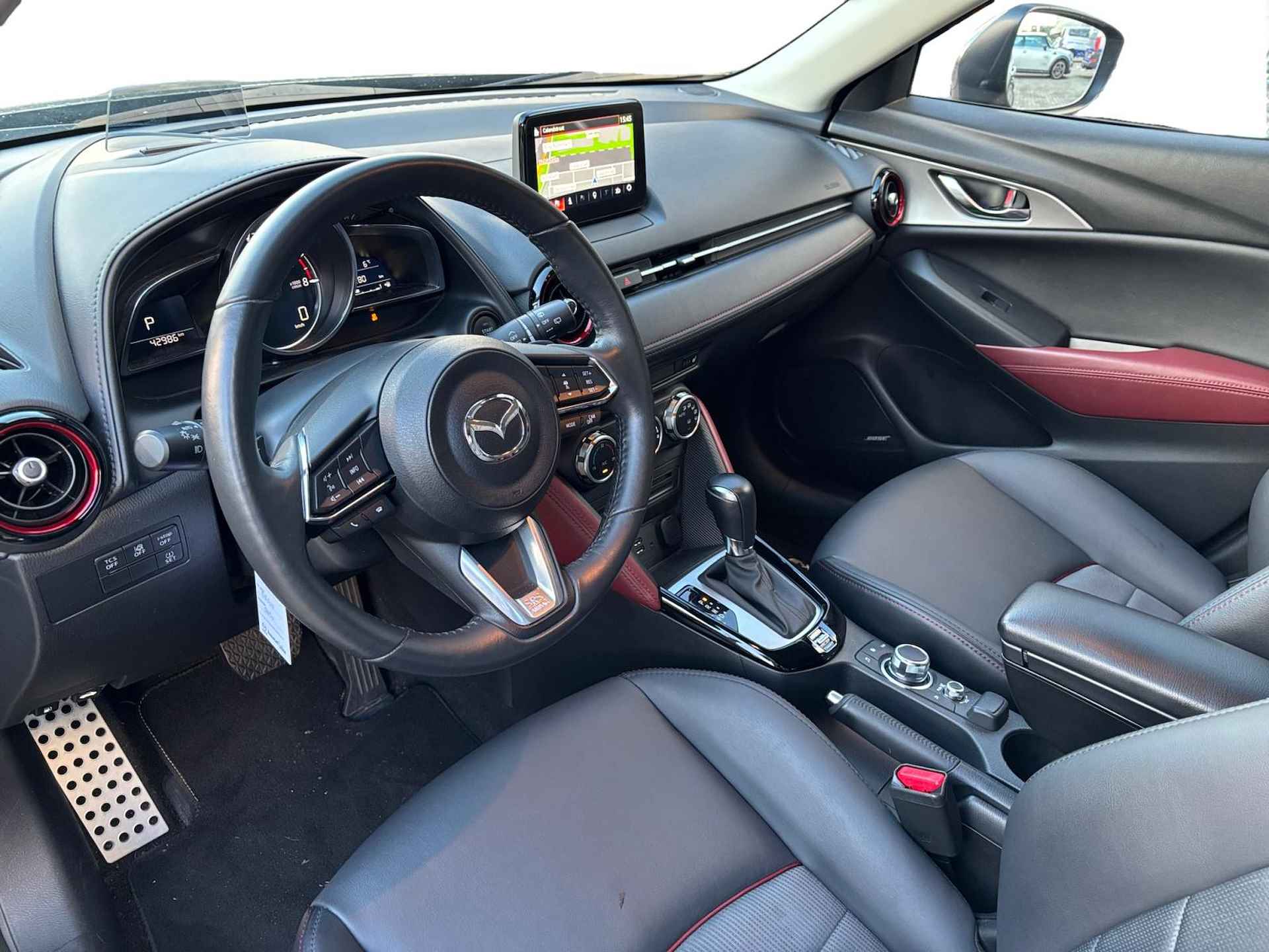 Mazda CX-3 2.0 SkyActiv-G 120 GT-M 1e Eigenaar | Navigatie | Achteruitrijcamera | PDV voor en achter | Leder interieur | Veiligheidssystemen - 26/29