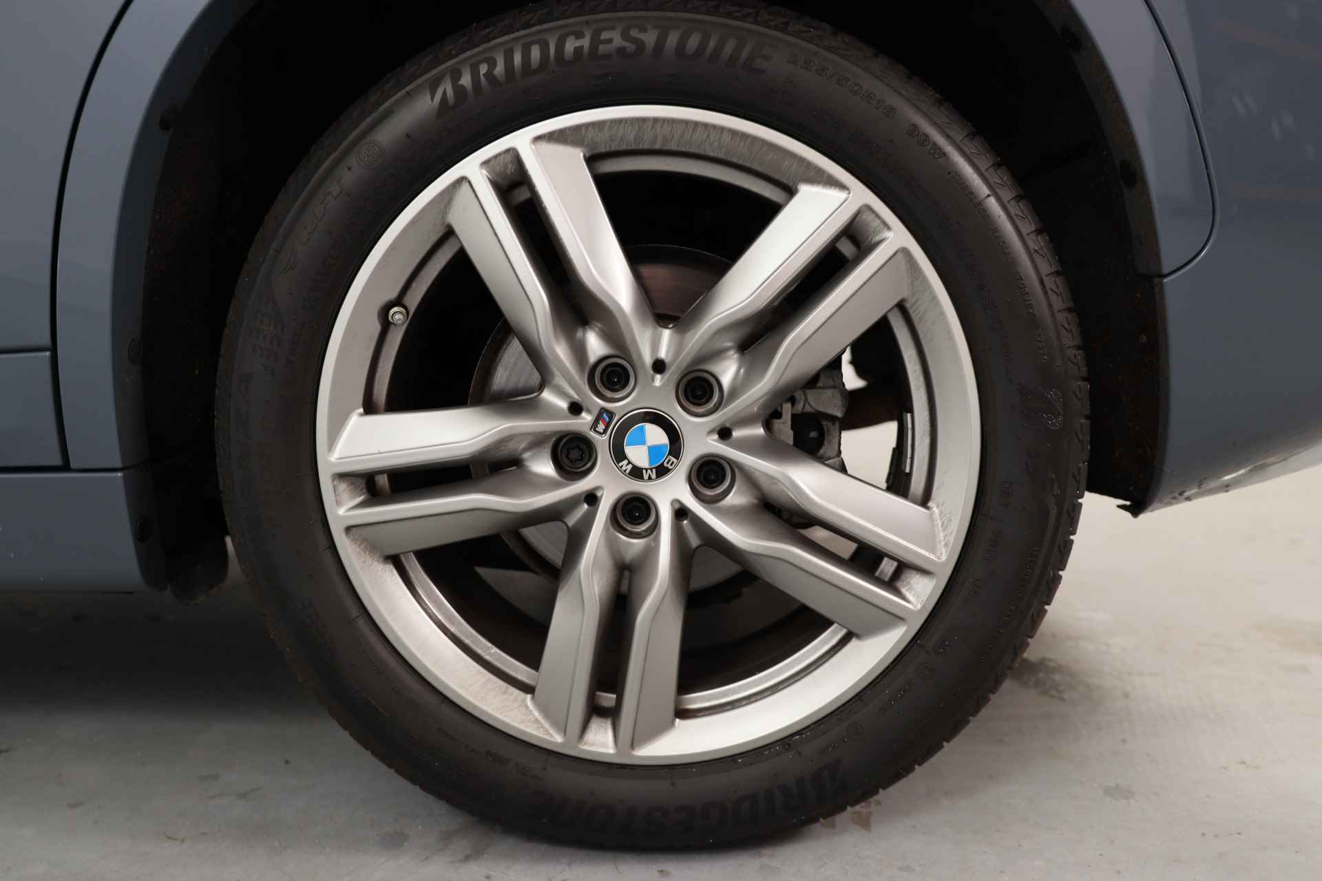 BMW X1 sDrive18i High Executive | M Sport | Adaptive Cruise | Led | Keyless | Camera | Elektr achterklep | Stoelverwarming | Sportstoel - 23/38