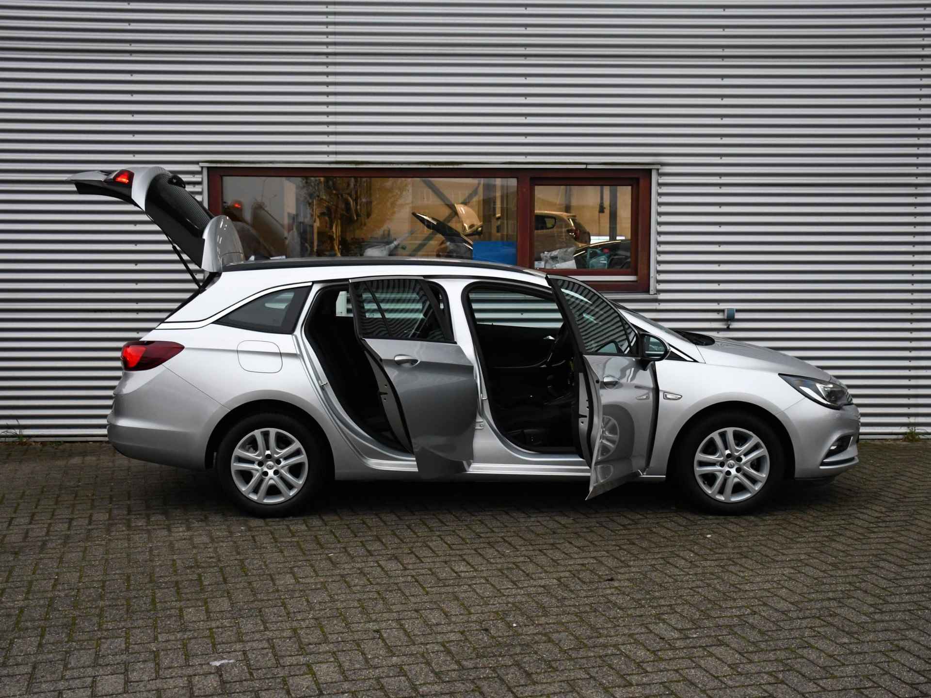 Opel Astra Sports Tourer Business+ 1.0 105pk NAVI | APPLE CARPLAY | PDC ACHTER | DAB | USB | 12MND GARANTIE - 28/29