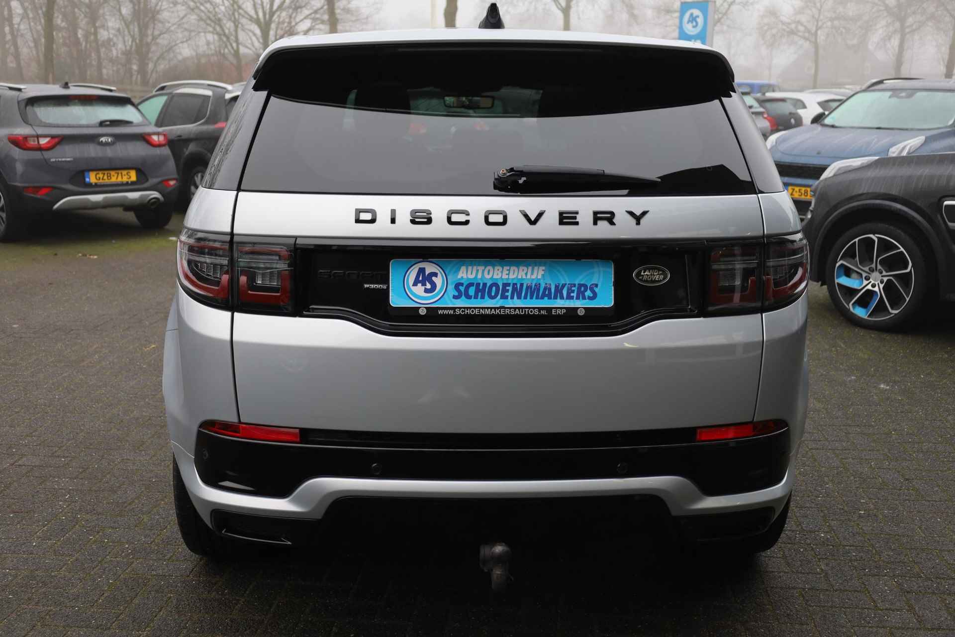 Land Rover Discovery Sport P300e 1.5 R-Dynamic PANO WINDSOR-LEER MEMORY ELEK.TREKHAAK 20"LMV CAMERA RUITVERWARMING MERIDIAN GSM-LADER ELEK.LAADKLEP 4x4 STOELVERW. ZWARTE-HEMEL NAVI - 50/61