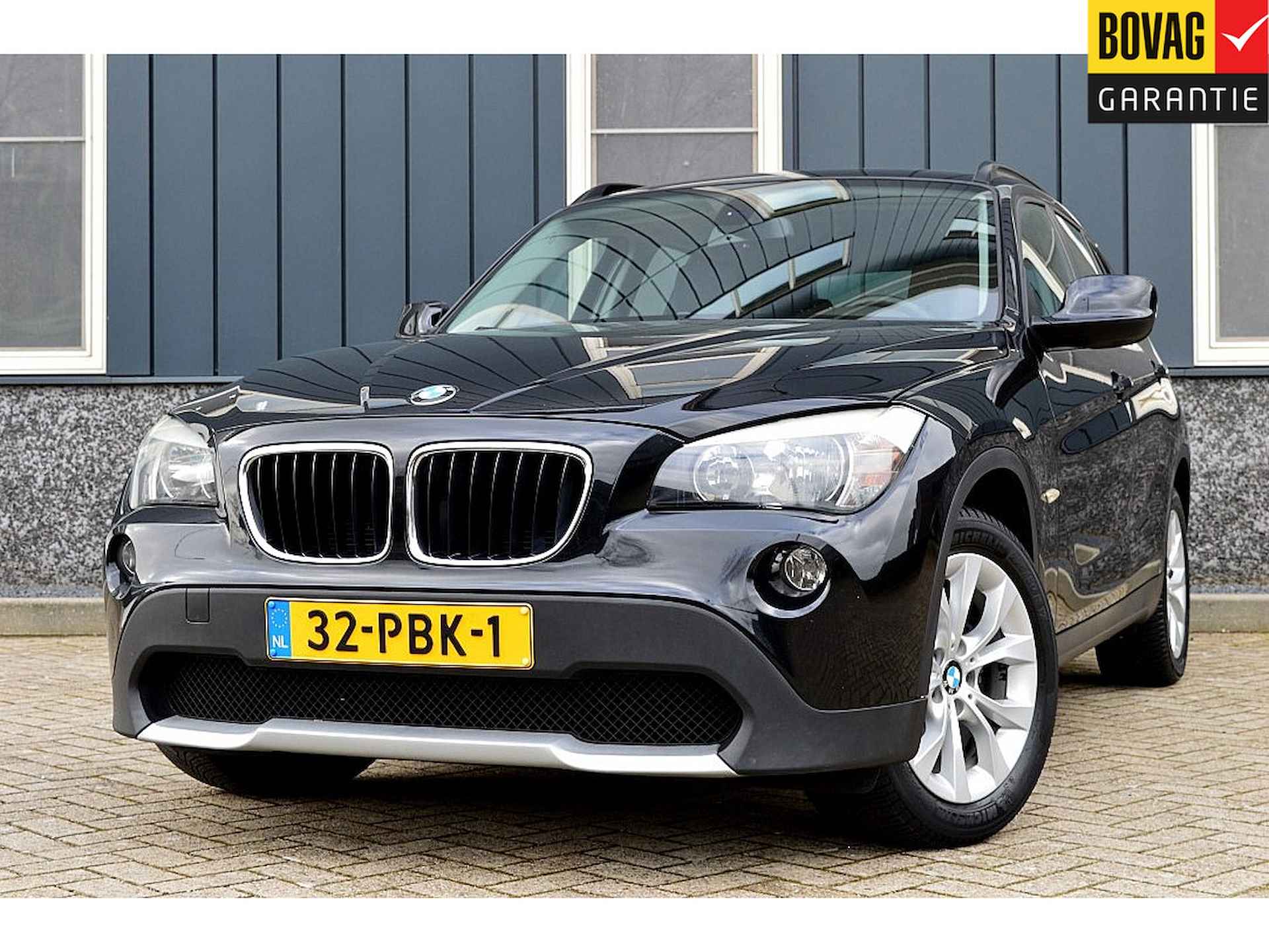 BMW X1 sDrive18i Executive Rijklaarprijs-Garantie Navigatie Sport interieur Airco - 1/29