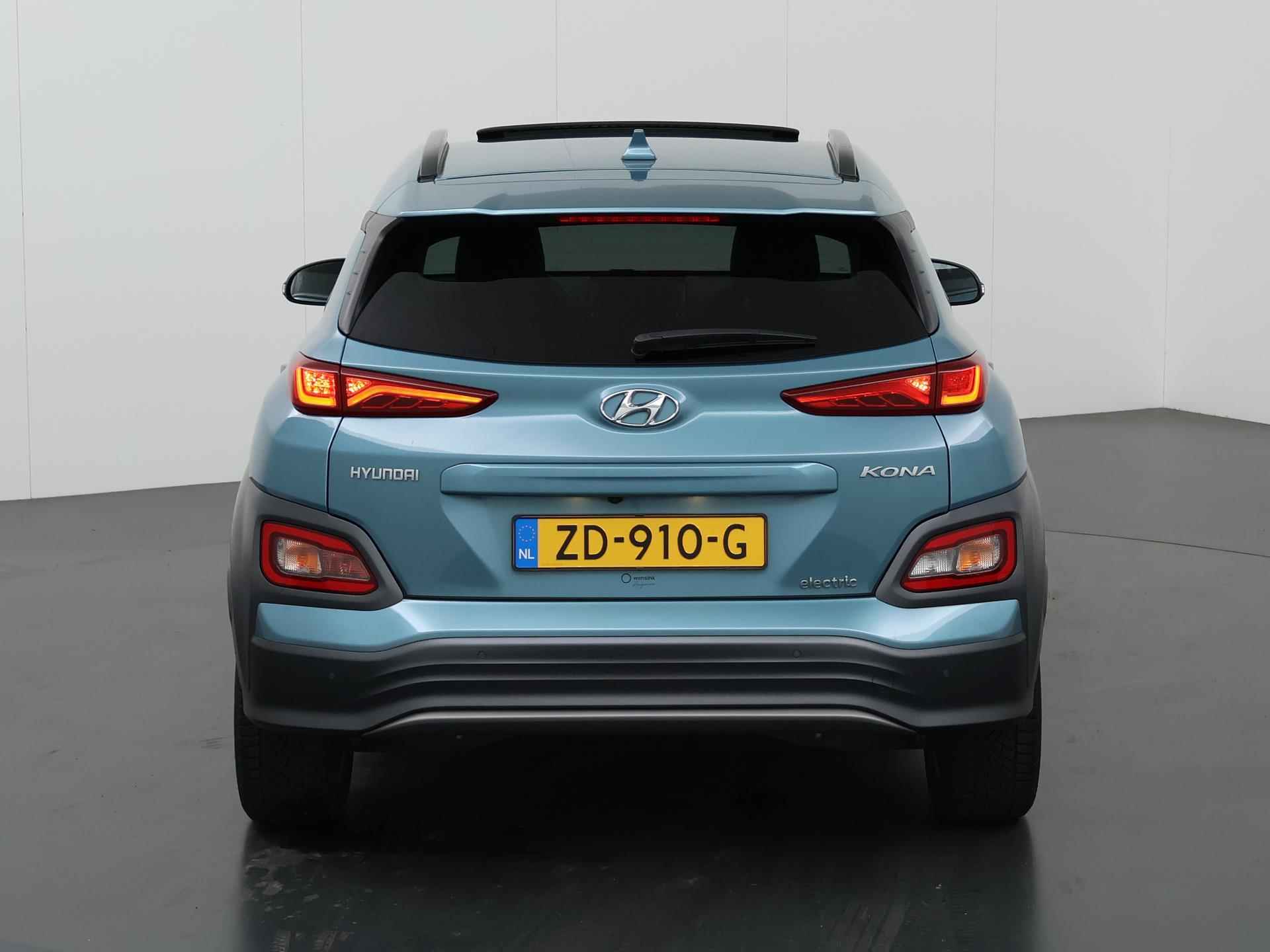 Hyundai Kona EV Premium 64 kWh | Schuif/Kantel dak | Navigatie | Camera | Stoelverwarming/Koeling | HUD | Lederen bekleding | Ele. verstelbare stoelen | Apple CarPlay | Krell Audio | - 5/48