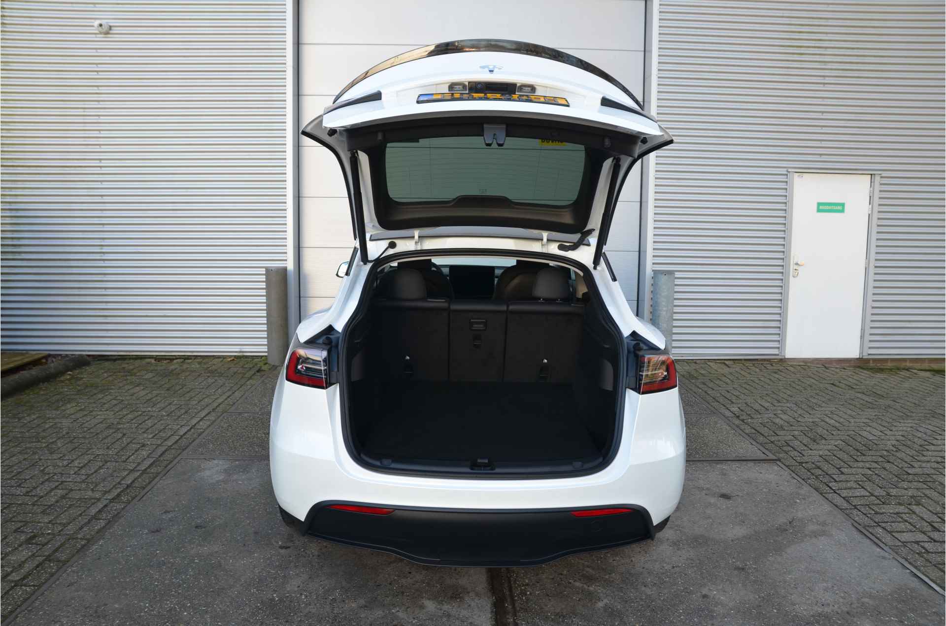 Tesla Model Y RWD 58 kWh AutoPilot, Warmtepomp, LFP accu dus 100% Opladen - 32/34