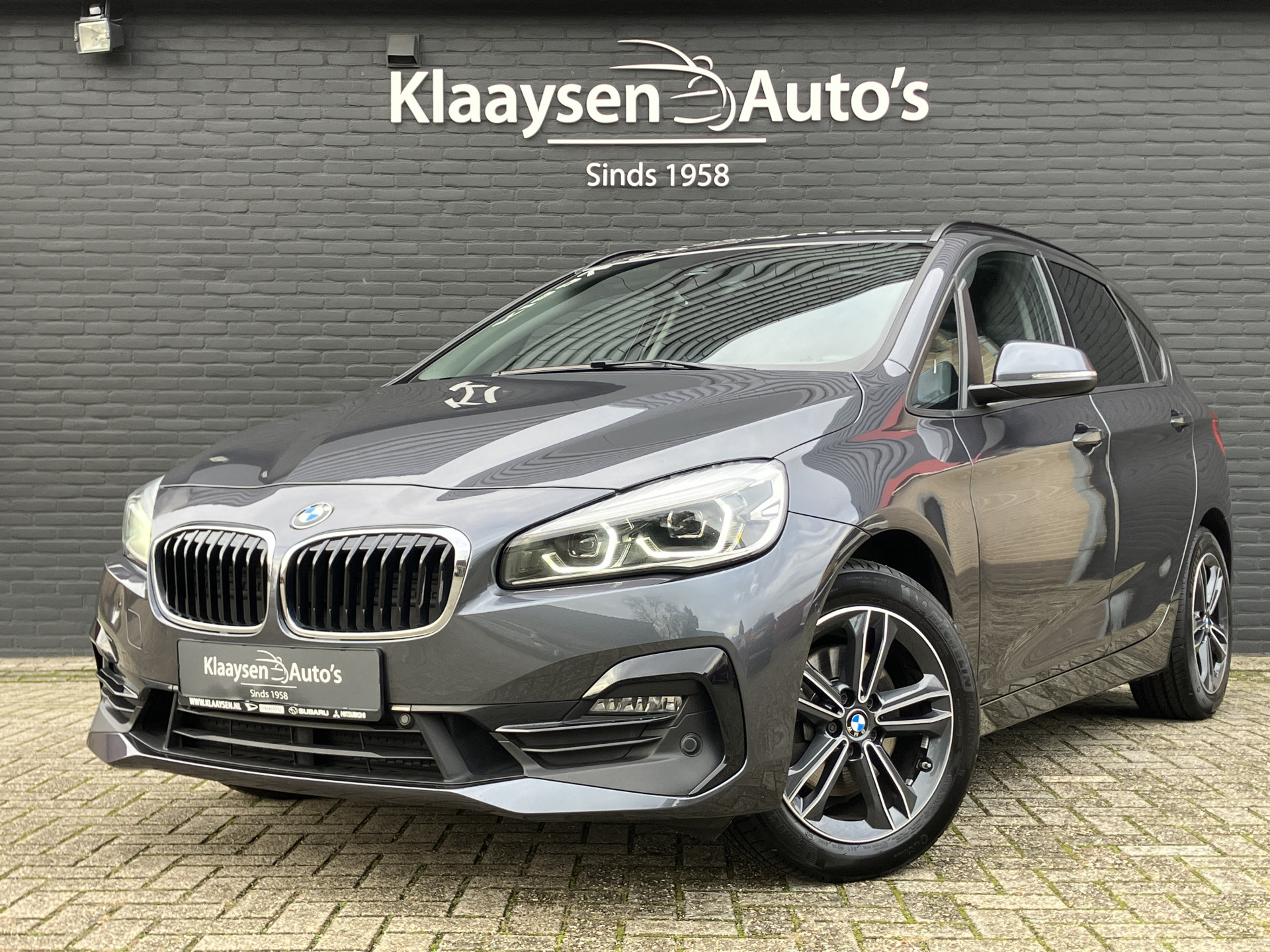 BMW 2 Serie Active Tourer 220i High Executive 192 pk AUT. | 1e eigenaar | dealer onderhouden | leder sportstoelen | navigatie | DAB