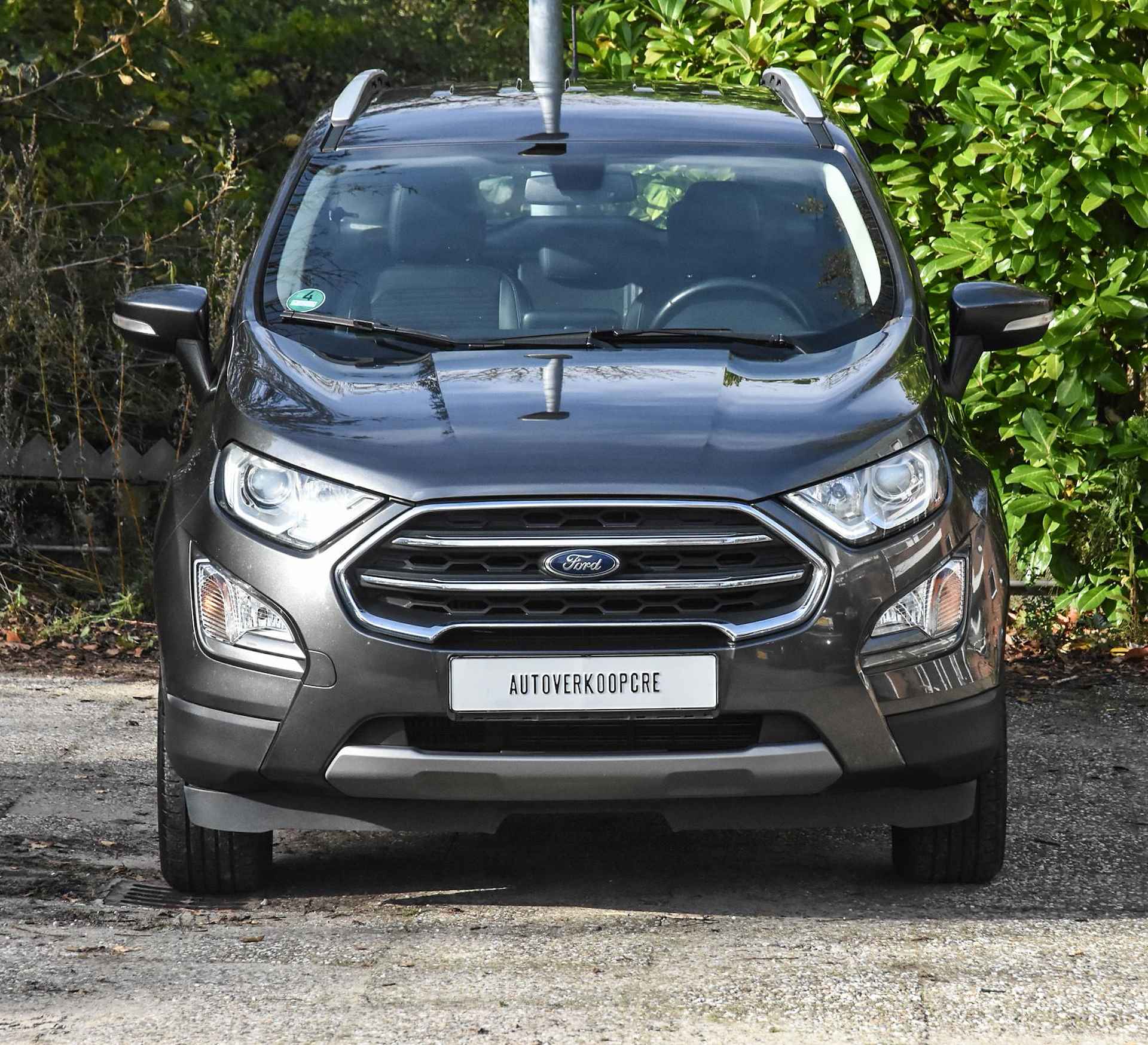 Ford EcoSport 1.0 EcoBoost Titanium automaat / verwarmd stuur / stoelverwarming / cruise control / navi / airco / half leer/half stof - 32/38