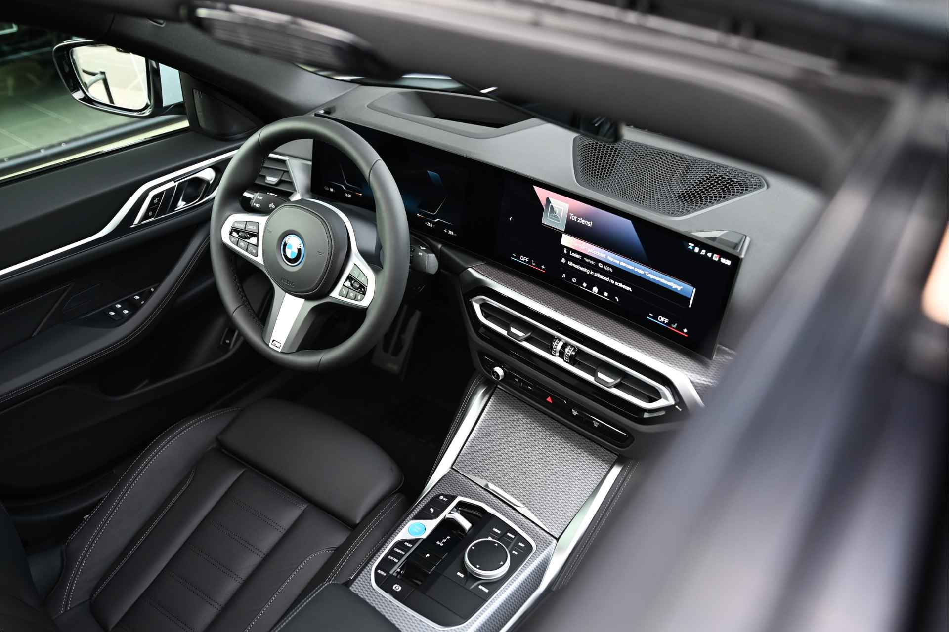 BMW i4 eDrive35 High Executive M Sport 70 kWh / Schuif-kanteldak / Active Cruise Control / Stoelverwarming / Parking Assistant / Live Cockpit Professional - 7/24