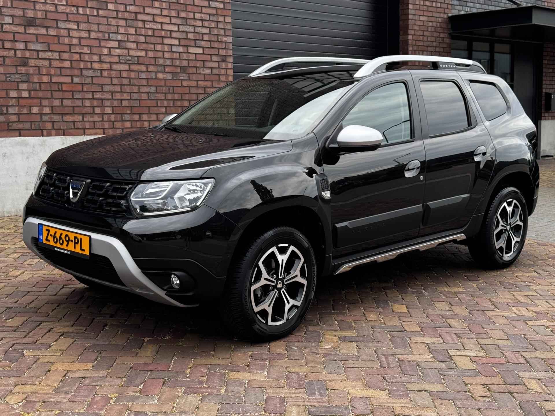 Dacia Duster 1.3 TCe Prestige / 130 PK / Trekhaak / Navigatie + Camera Rondom / Climate Control / Stoelverwarming - 14/52