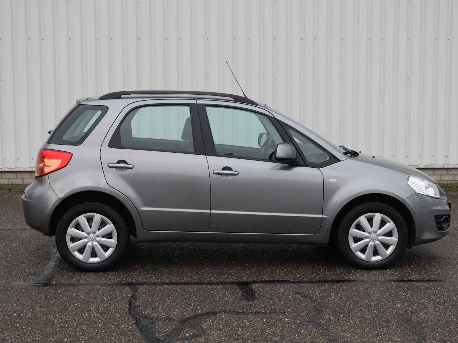 Suzuki SX4 1.6 Comfort | Airco | Radio CD MP3 | Dakrails | Stuurwielbediening | - 27/29